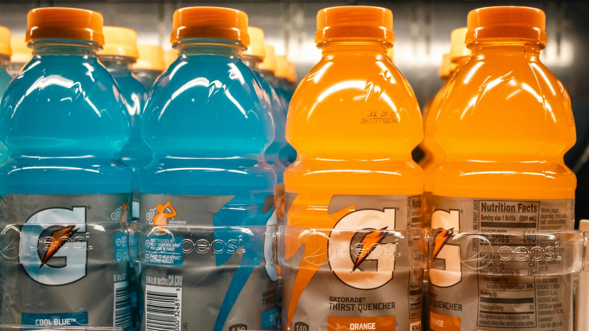 Gatorade bottles are shown on a shelf.