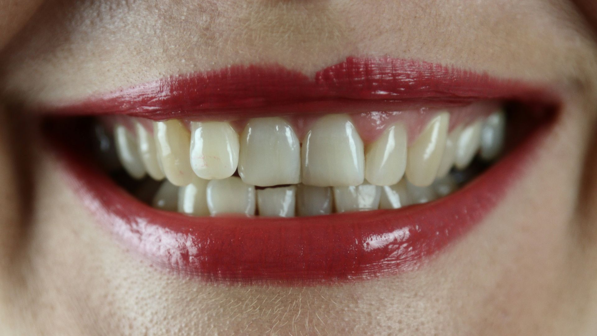 person with red lipstick and red lipstick