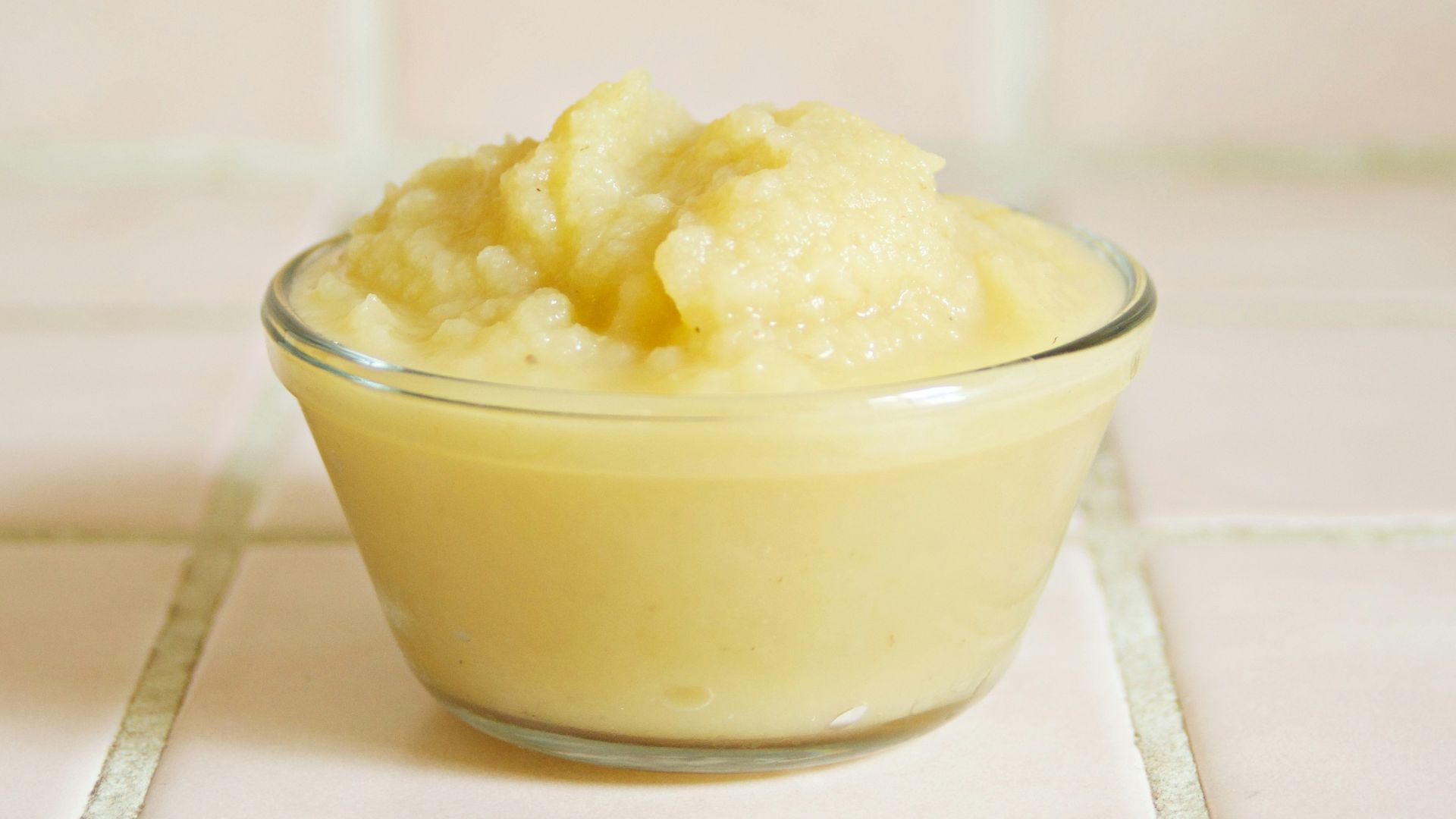 yellow cream in clear glass bowl