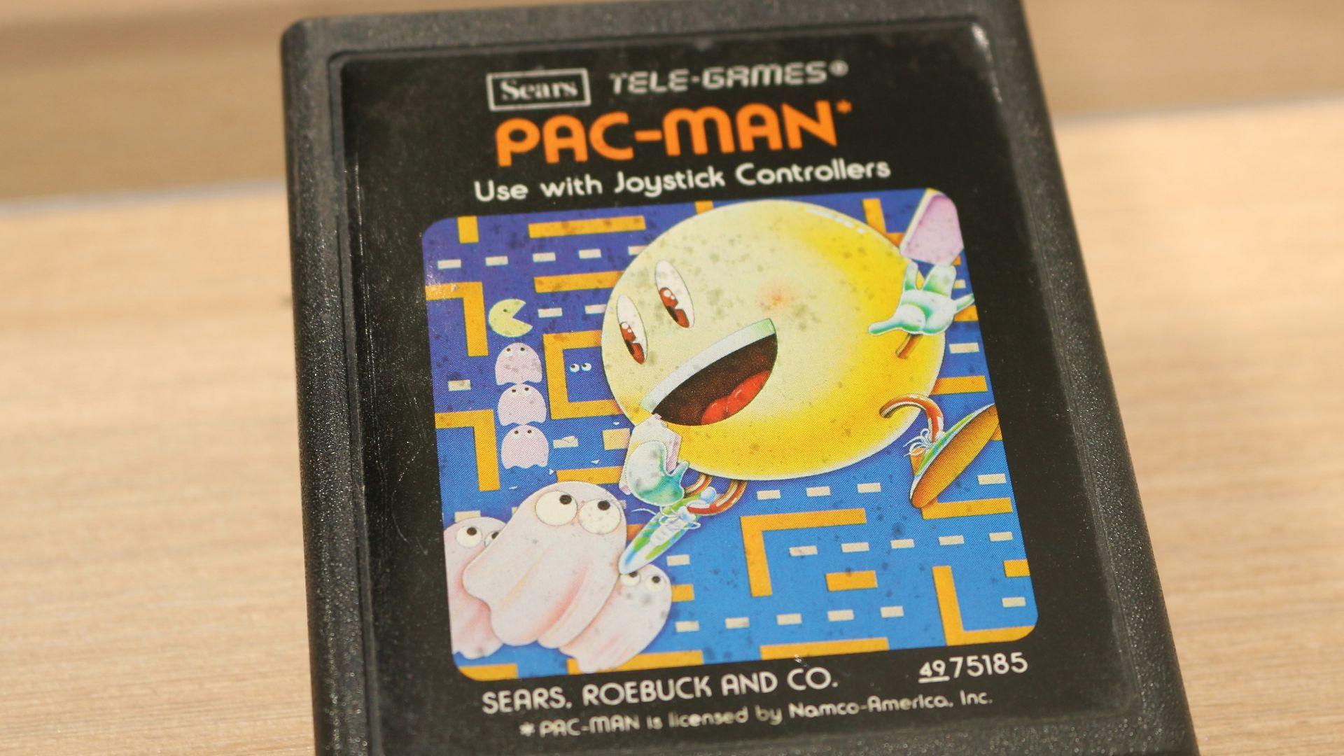 A video game sitting on top of a wooden table