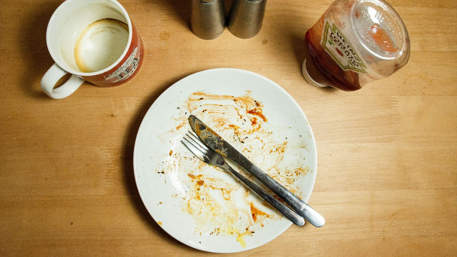 stainless steel fork and knife on white ceramic plate