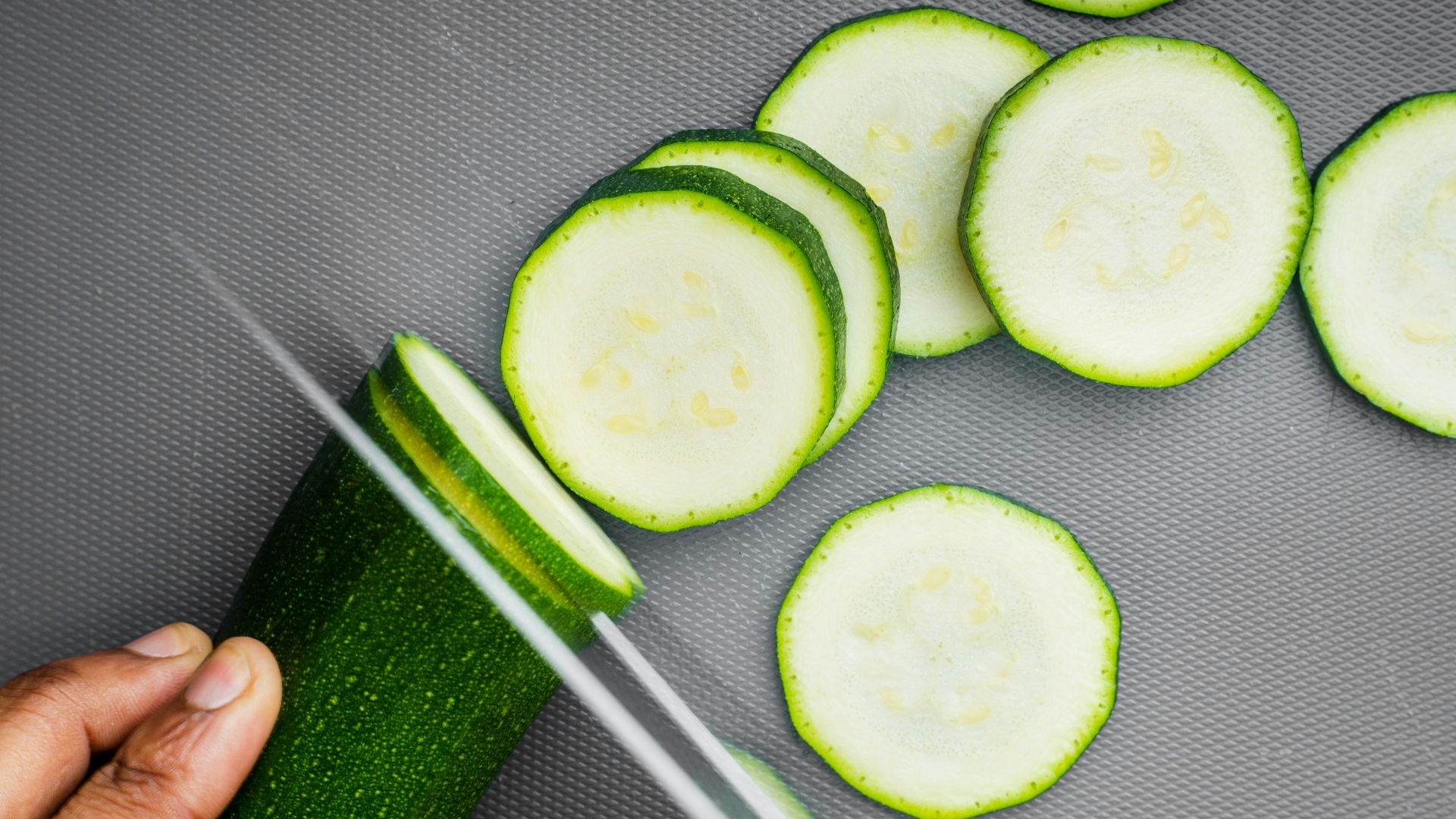 sliced cucumber on black textile