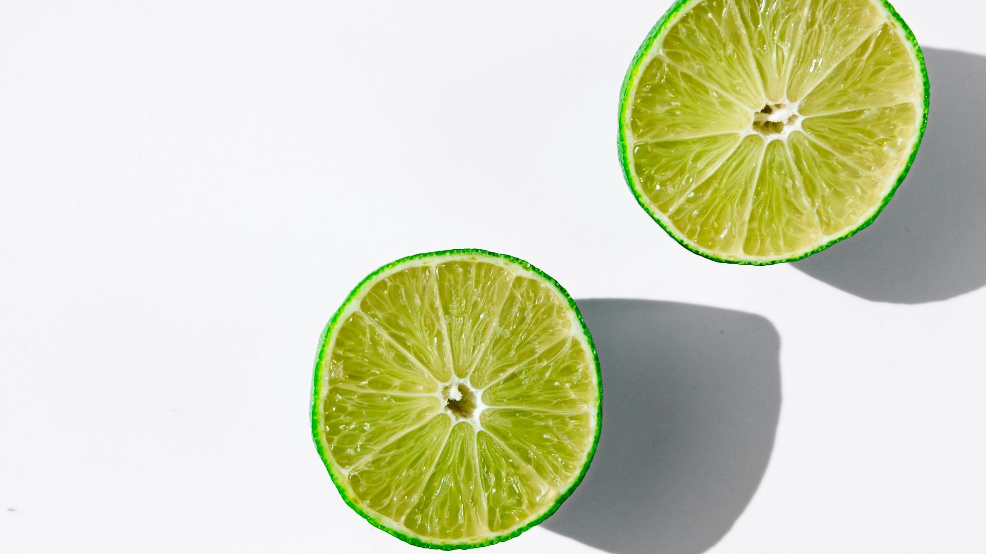 sliced lemon on white surface