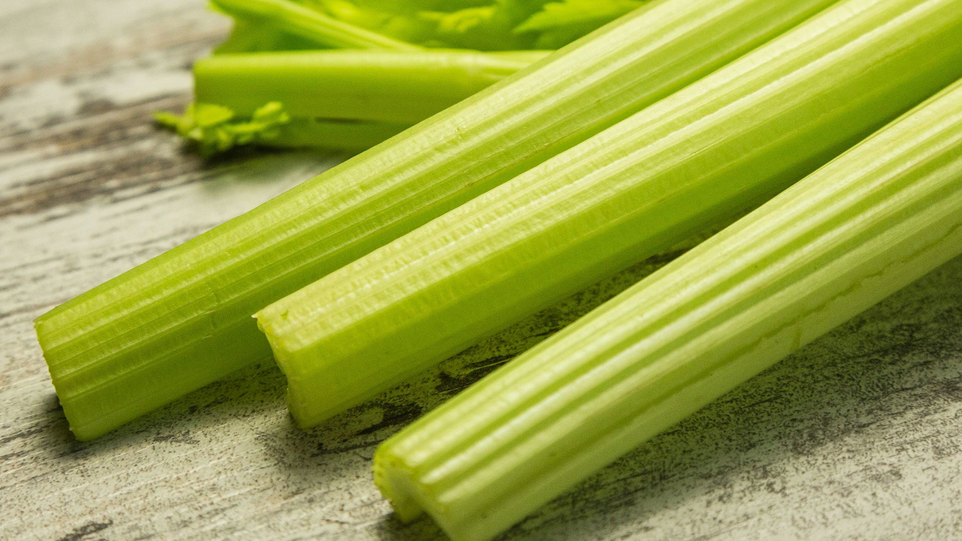 green vegetable on gray wooden table