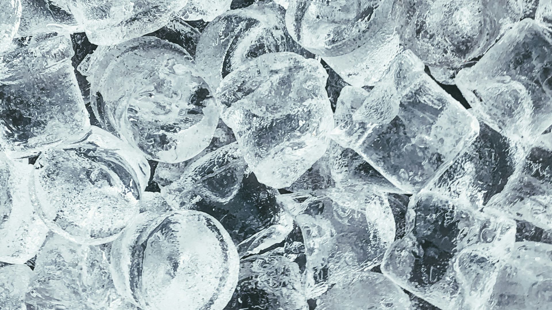 clear glass round ornament on gray stone