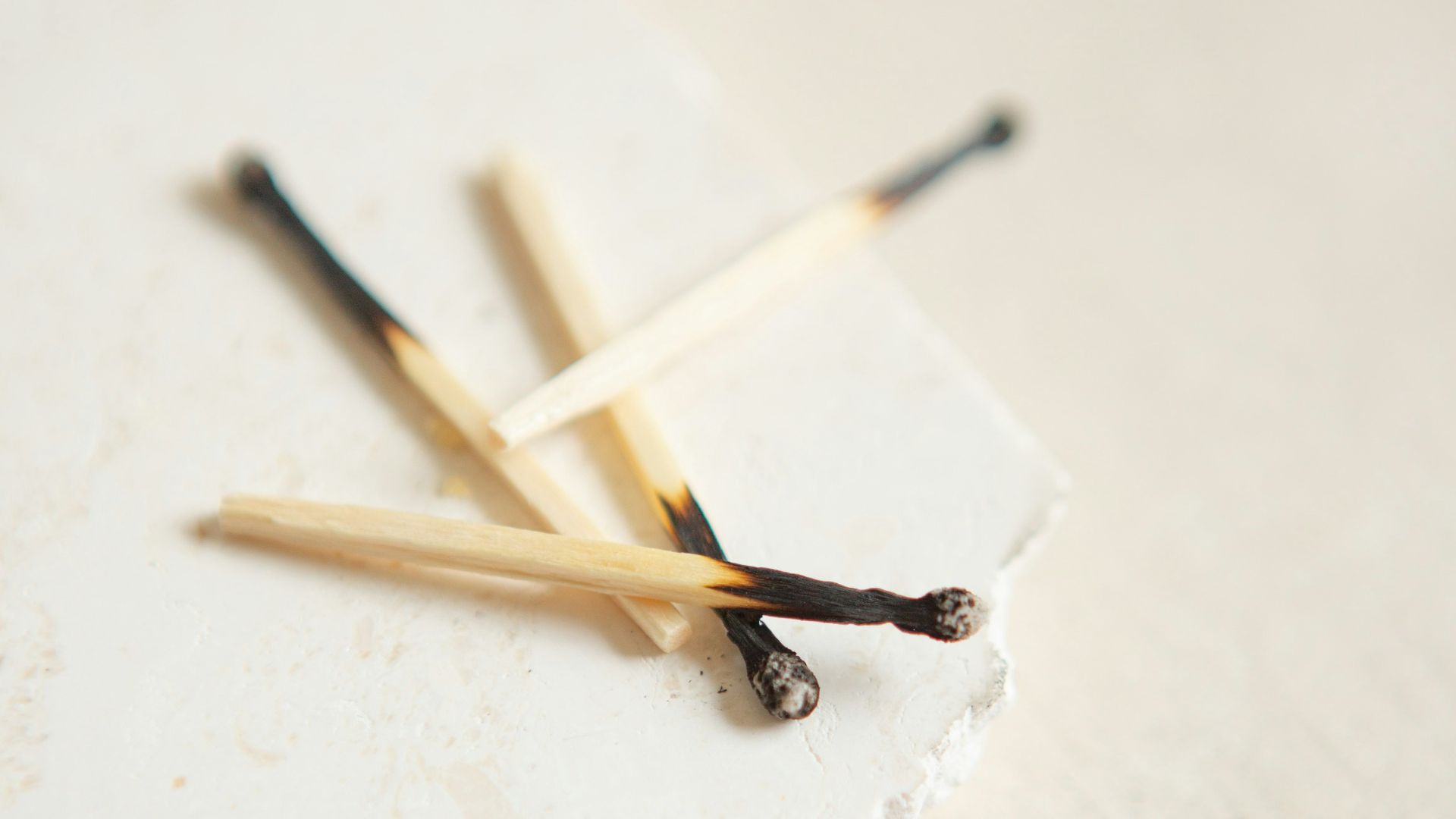 brown and white wooden sticks on white surface