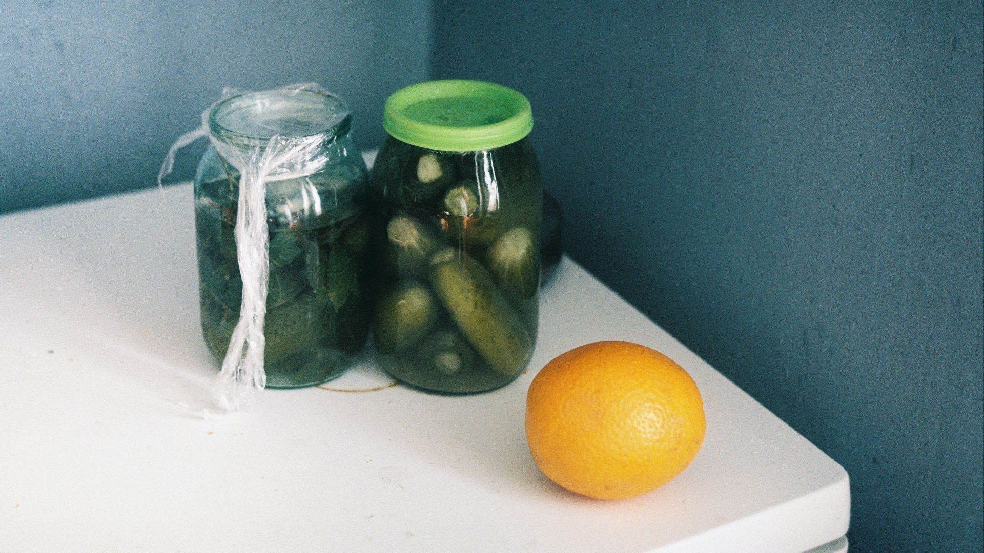 clear glass jar with green lid