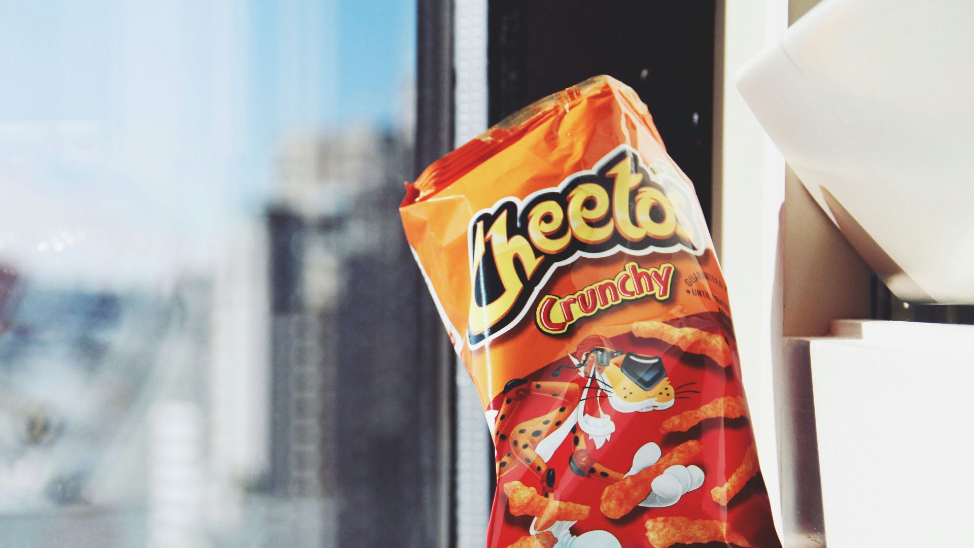 orange and yellow plastic pack on white table