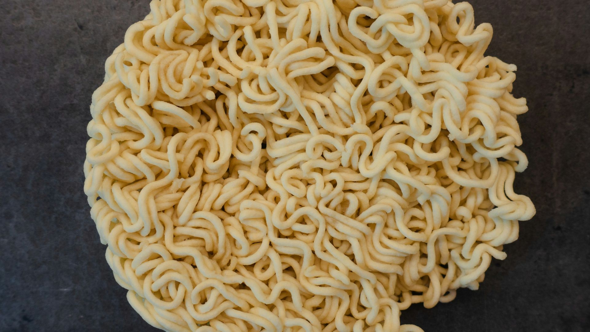 a bowl of ramen noodles on a table