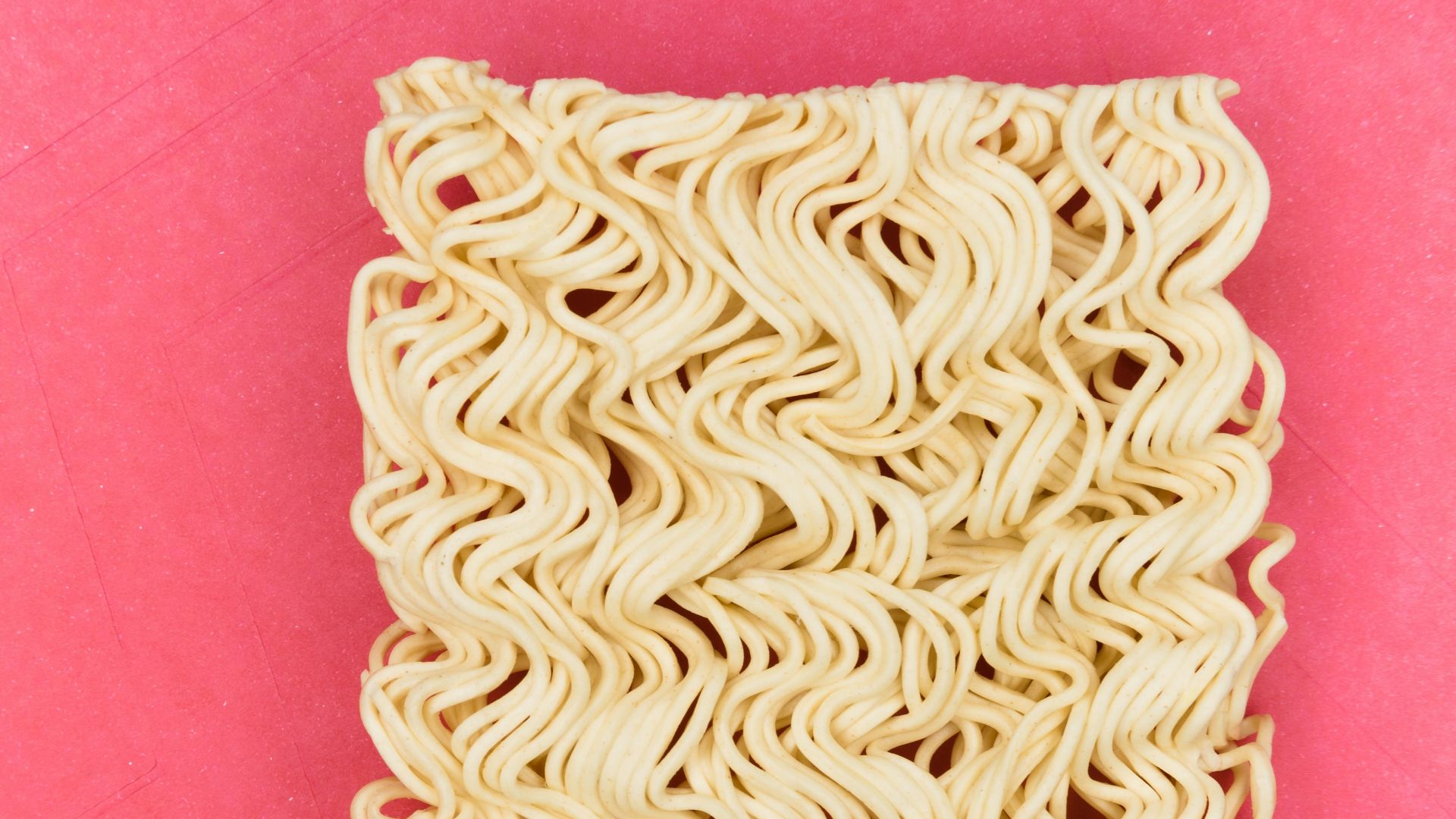 white and blue textile on pink textile