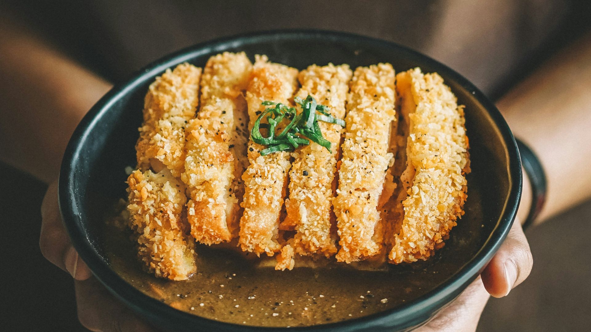 fried dish on round black plate