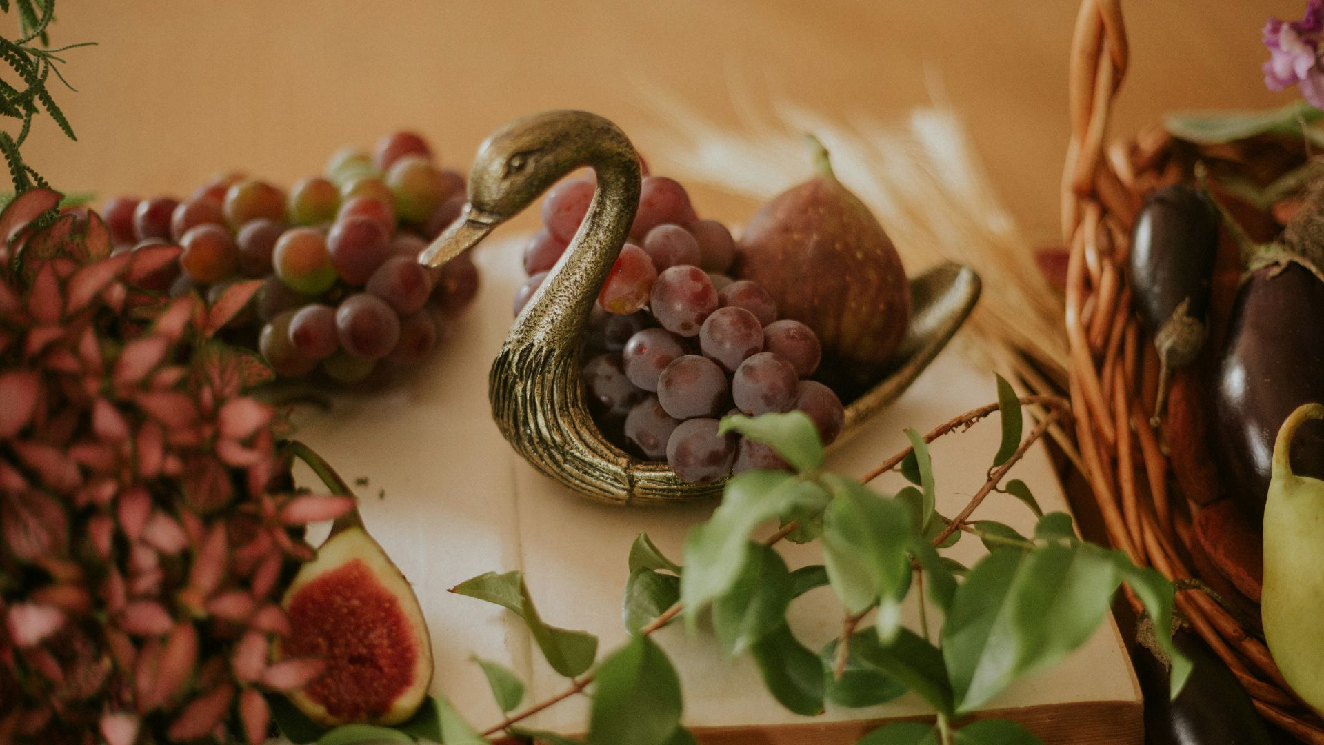 red round fruit on black and white ceramic bowl