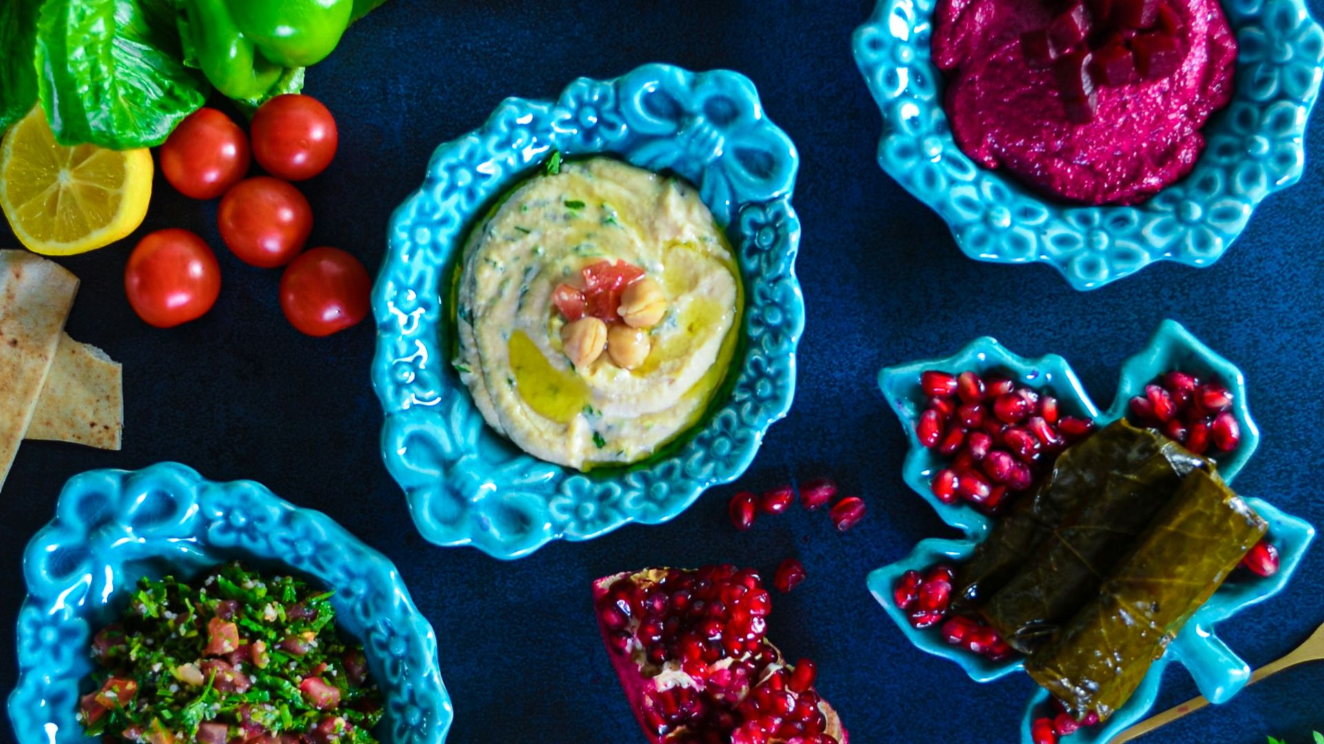 a table topped with plates and bowls of food