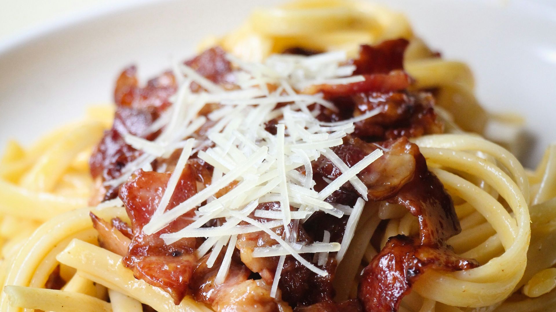 pasta with meat on white ceramic plate