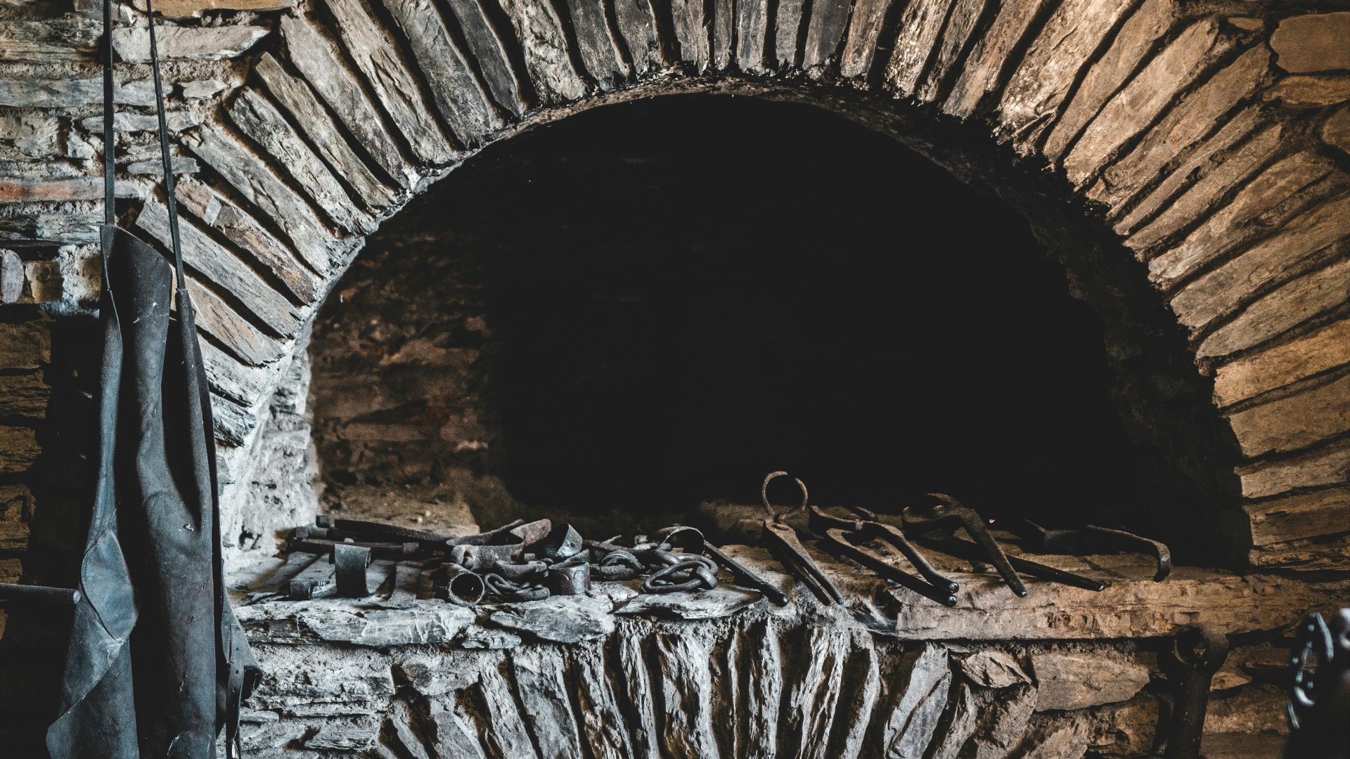brown brick tunnel with white and black stones