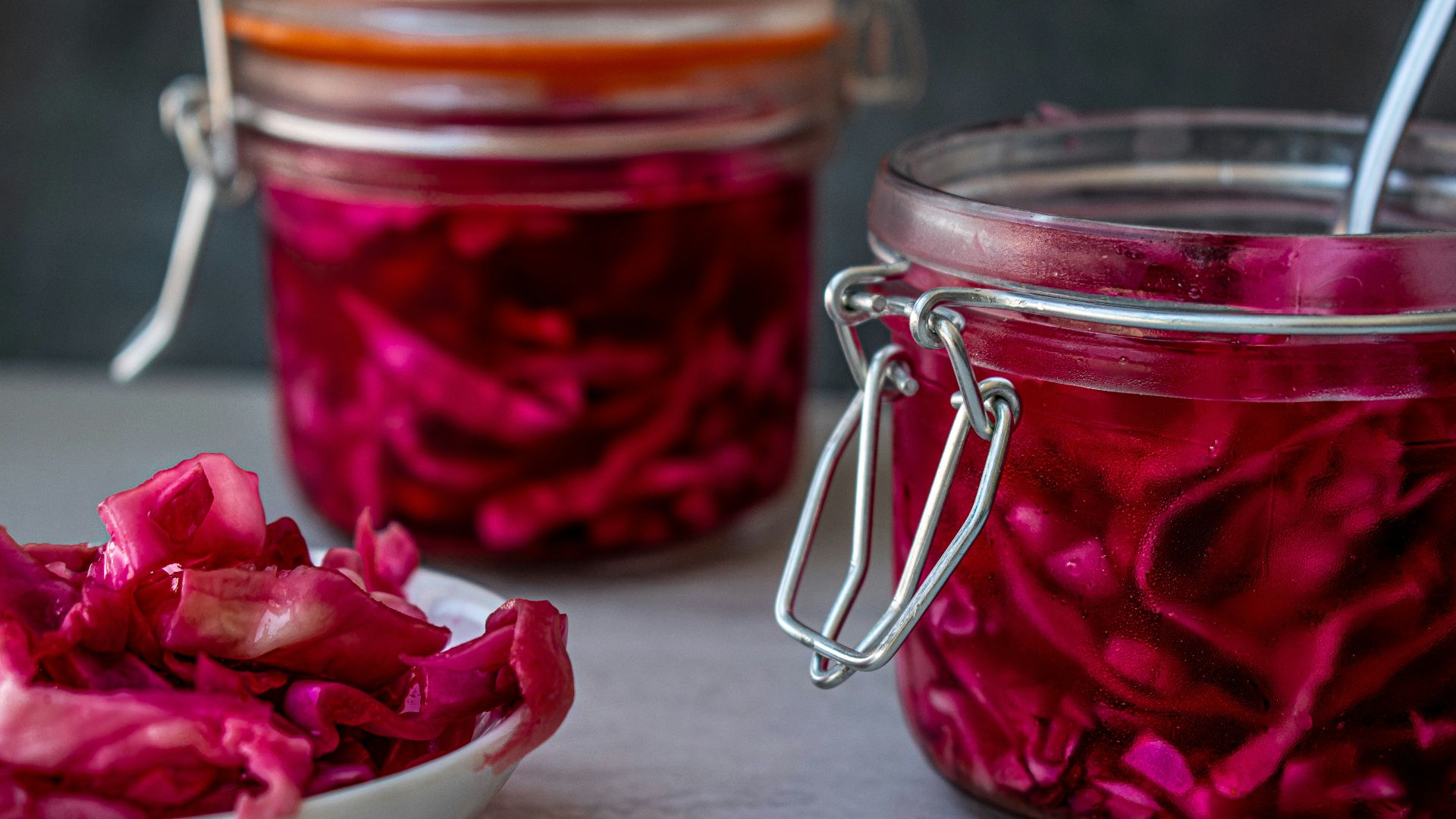 red liquid in clear glass jar