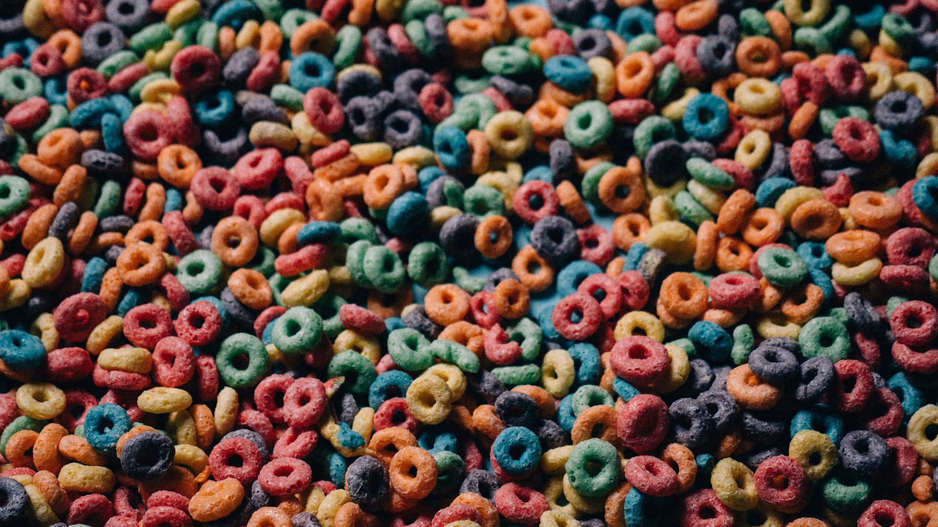 a large amount of colorful cereals and cereal rings