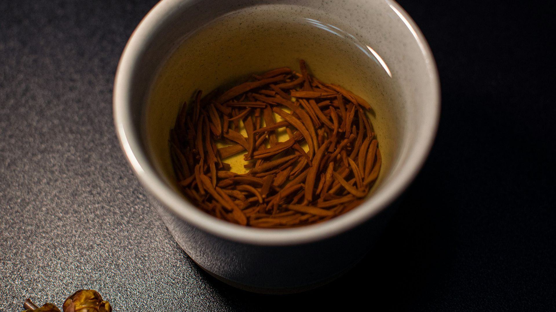 white ceramic mug with brown liquid inside