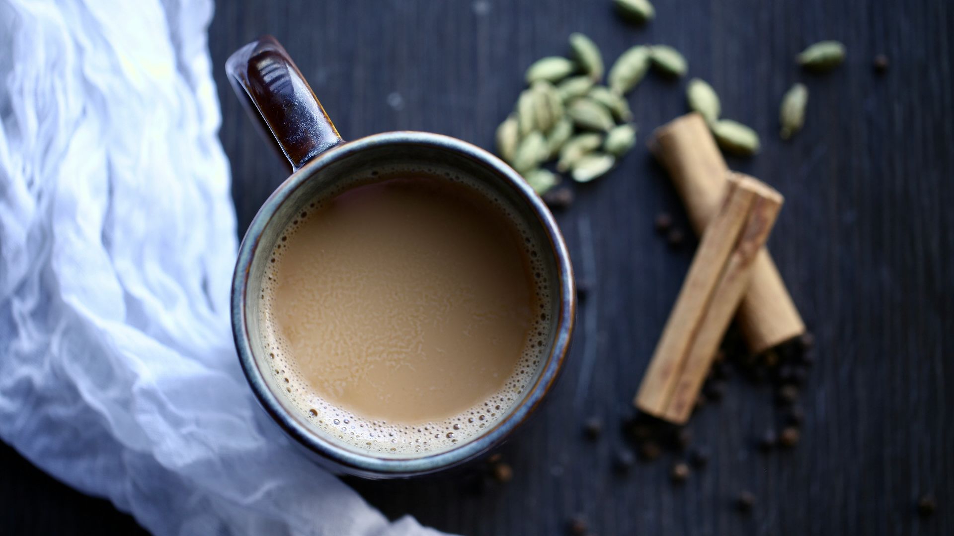 a cup of coffee sitting on top of a table