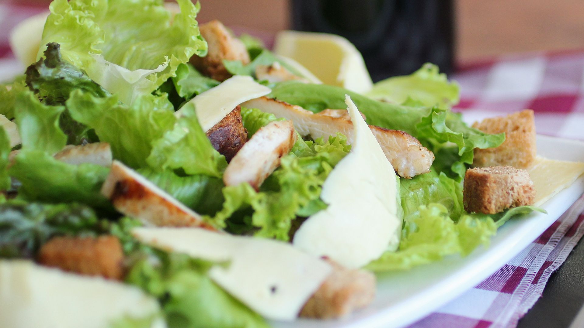 meat with lettuce on white ceramic plate