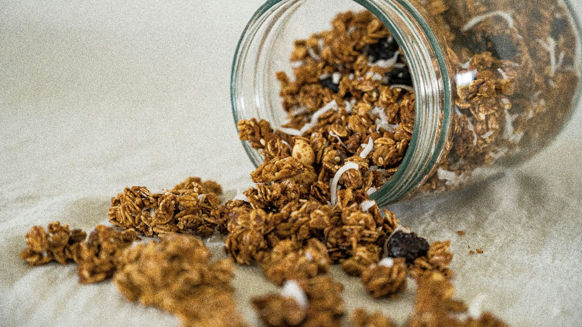 a glass bowl full of dried brown and white grains