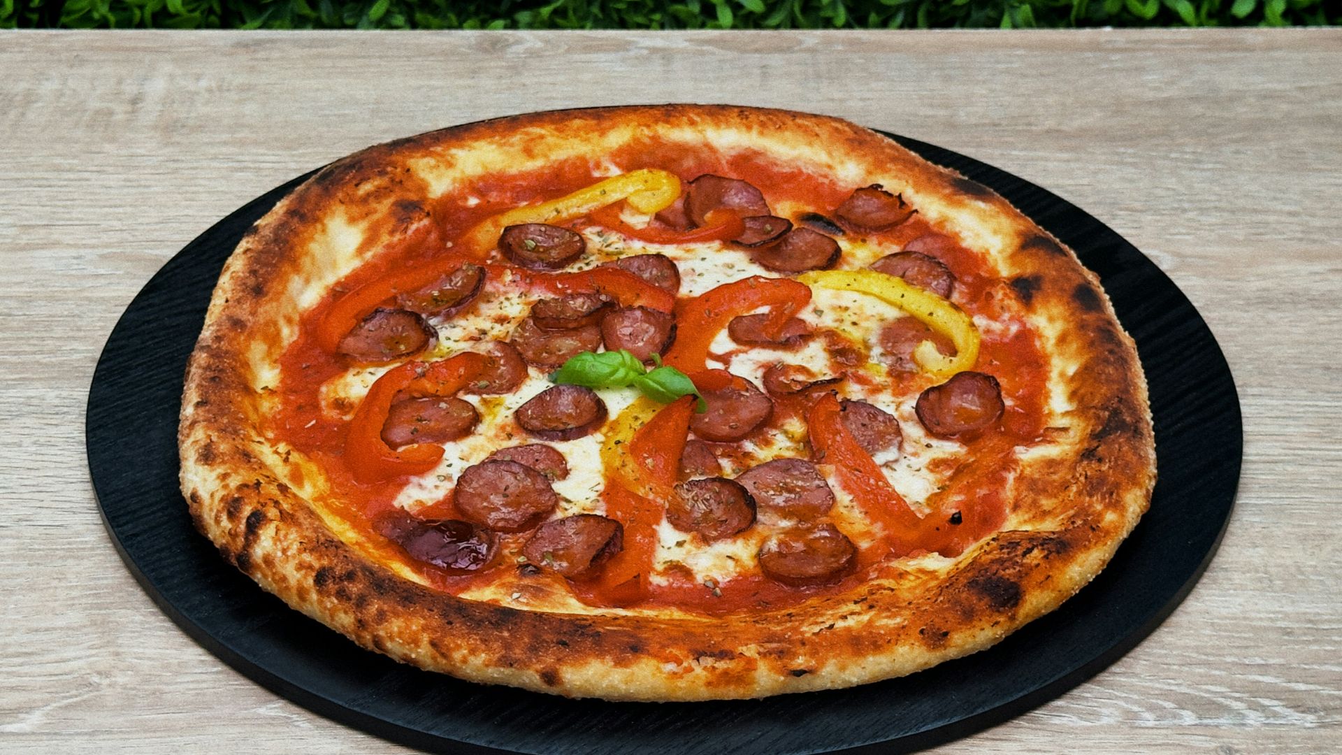 A pizza sitting on top of a wooden table