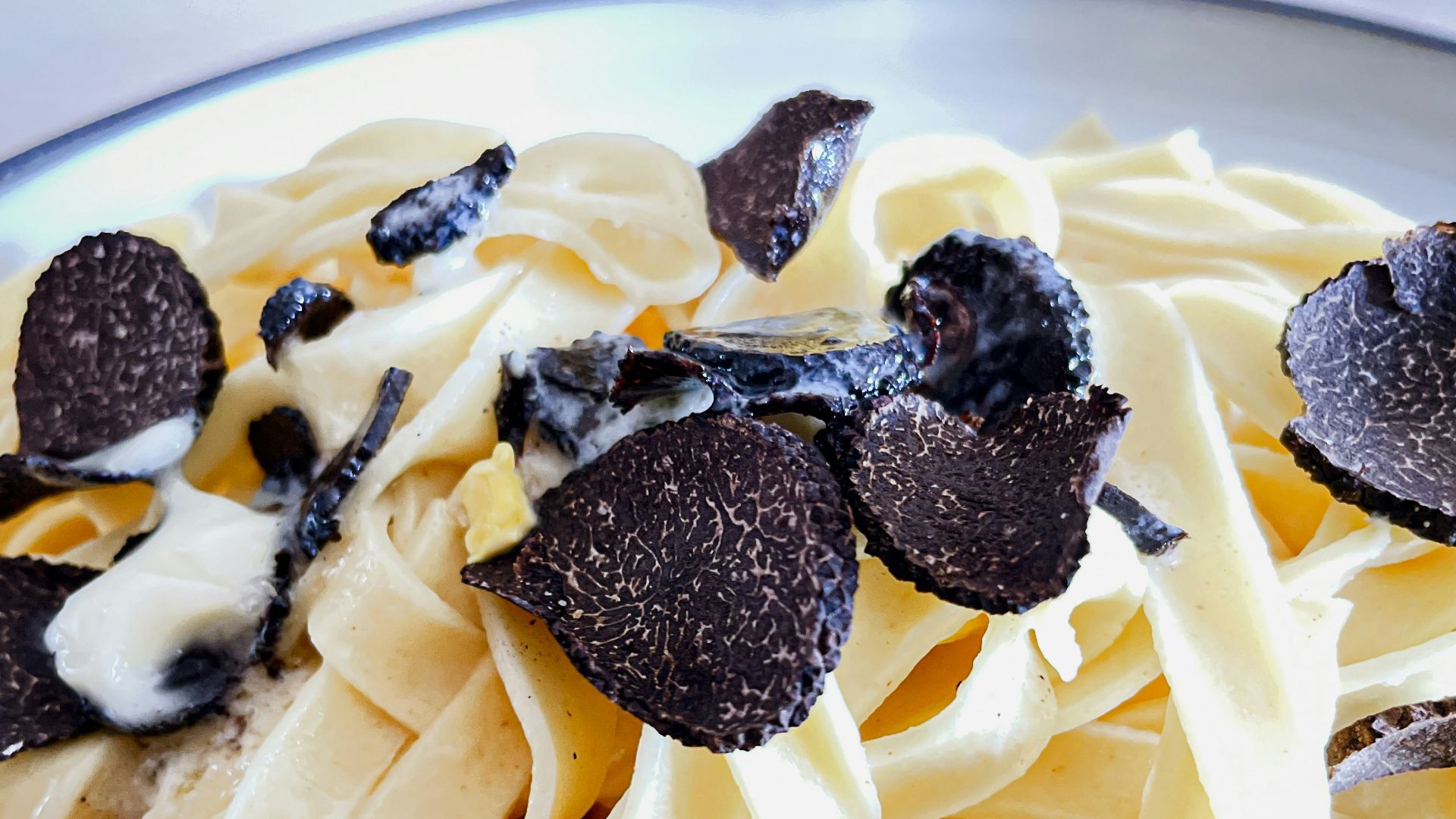 a plate of pasta with chocolate chips on top