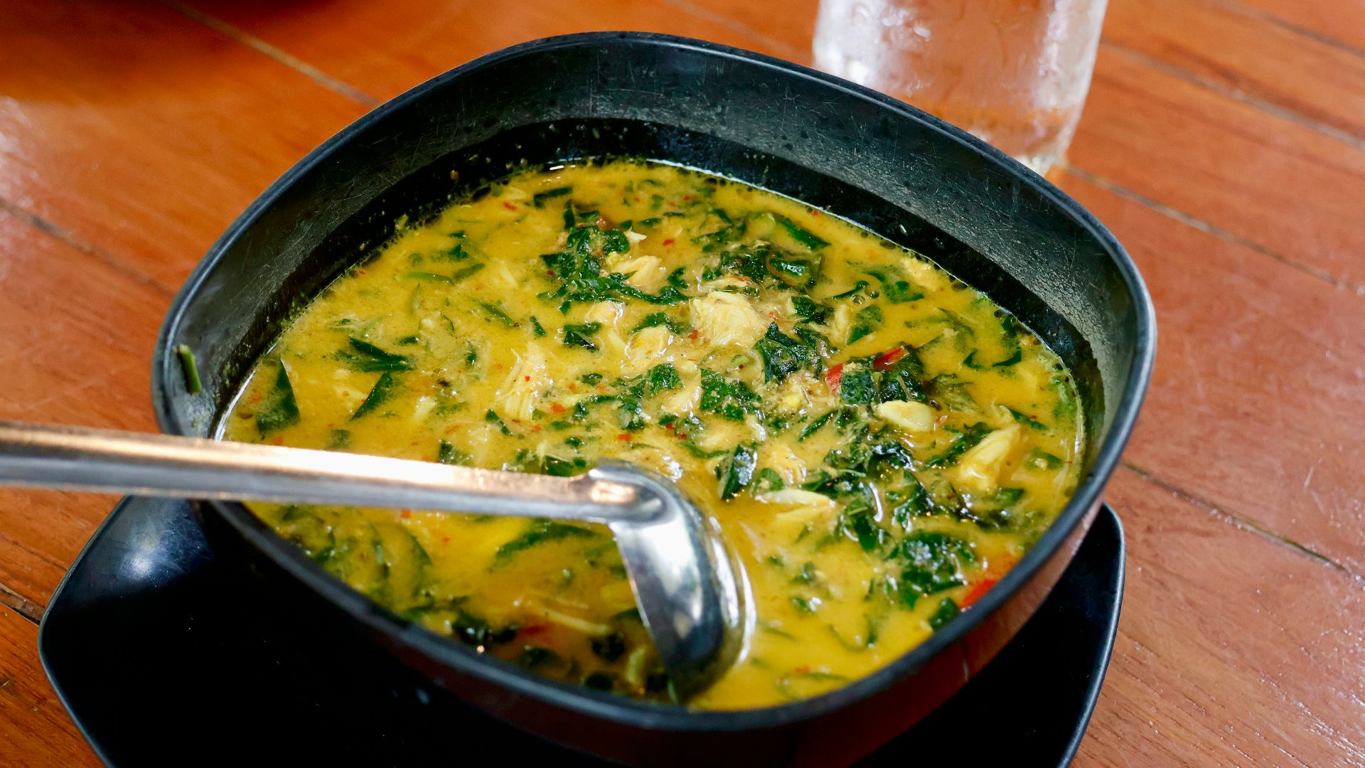a bowl of soup with a spoon in it