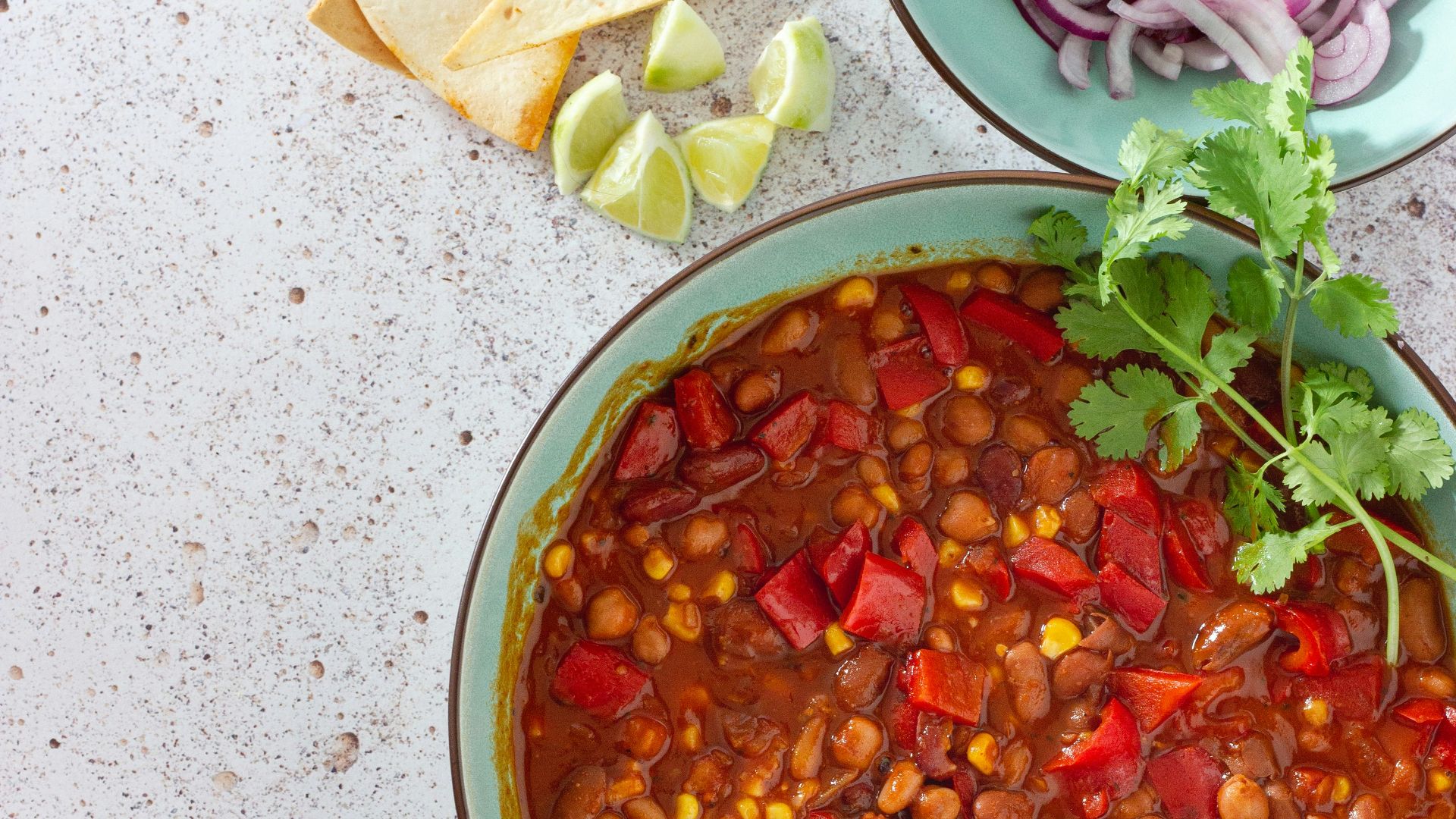 red and green chili peppers in white ceramic bowl