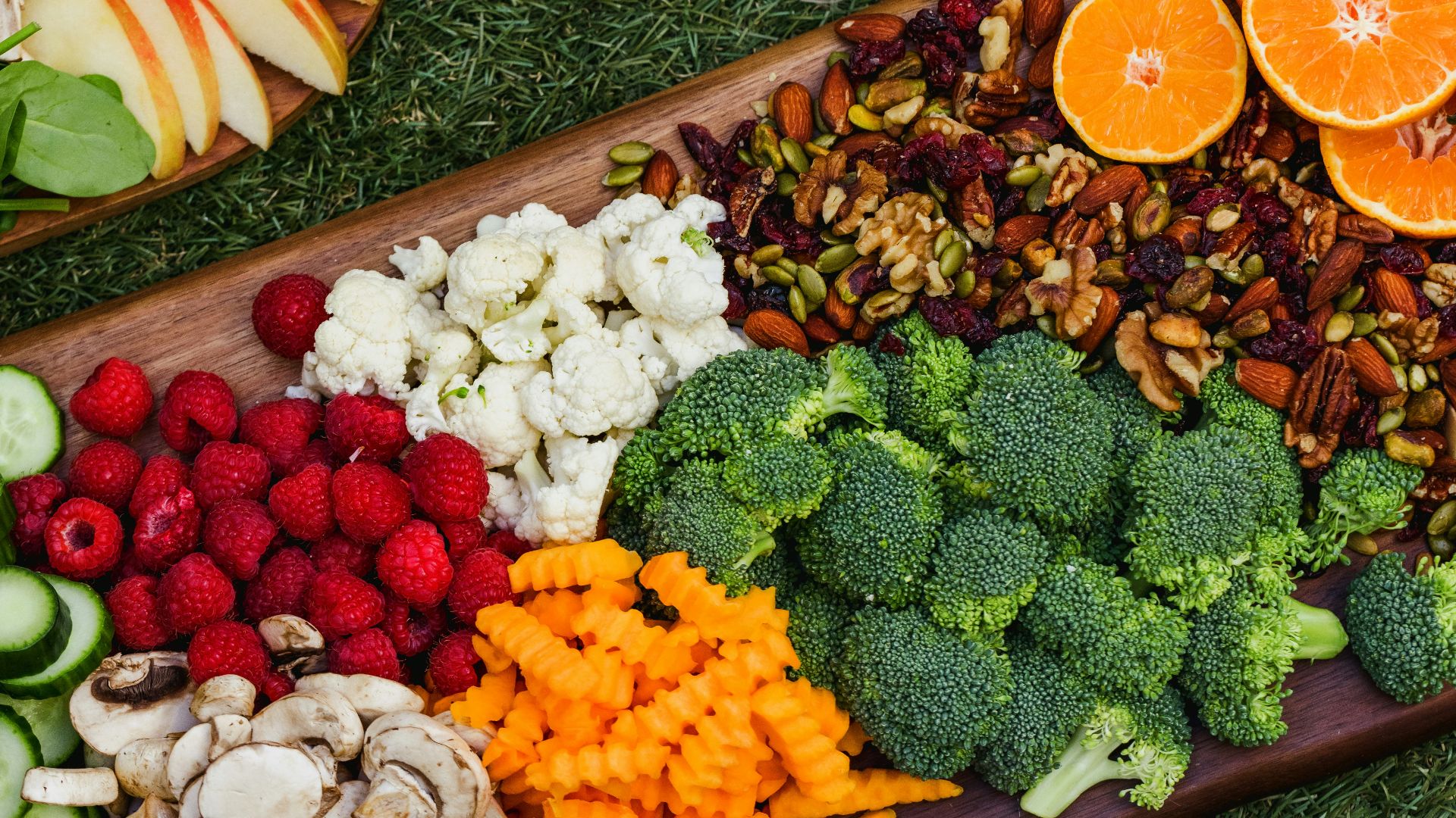 sliced orange fruits on brown wooden tray