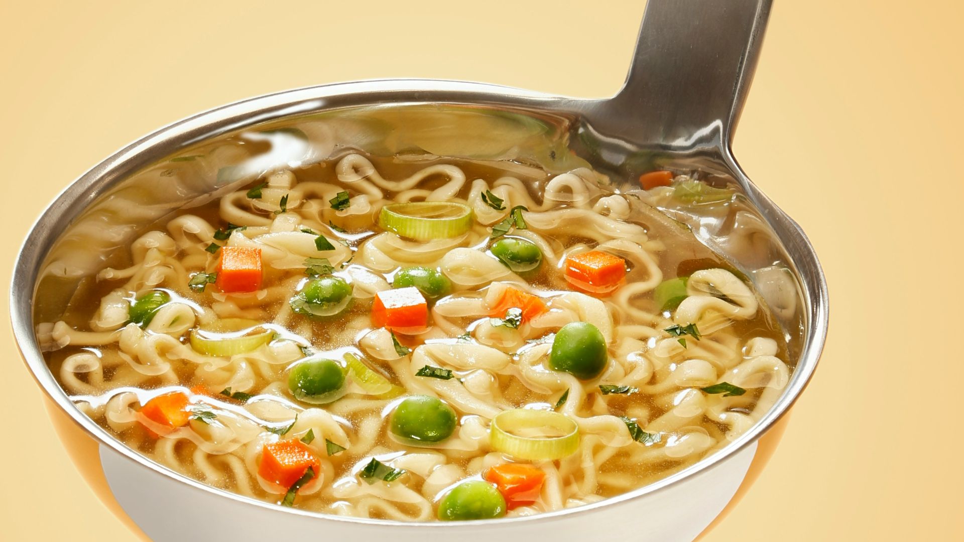 silver steel scoop with noodles