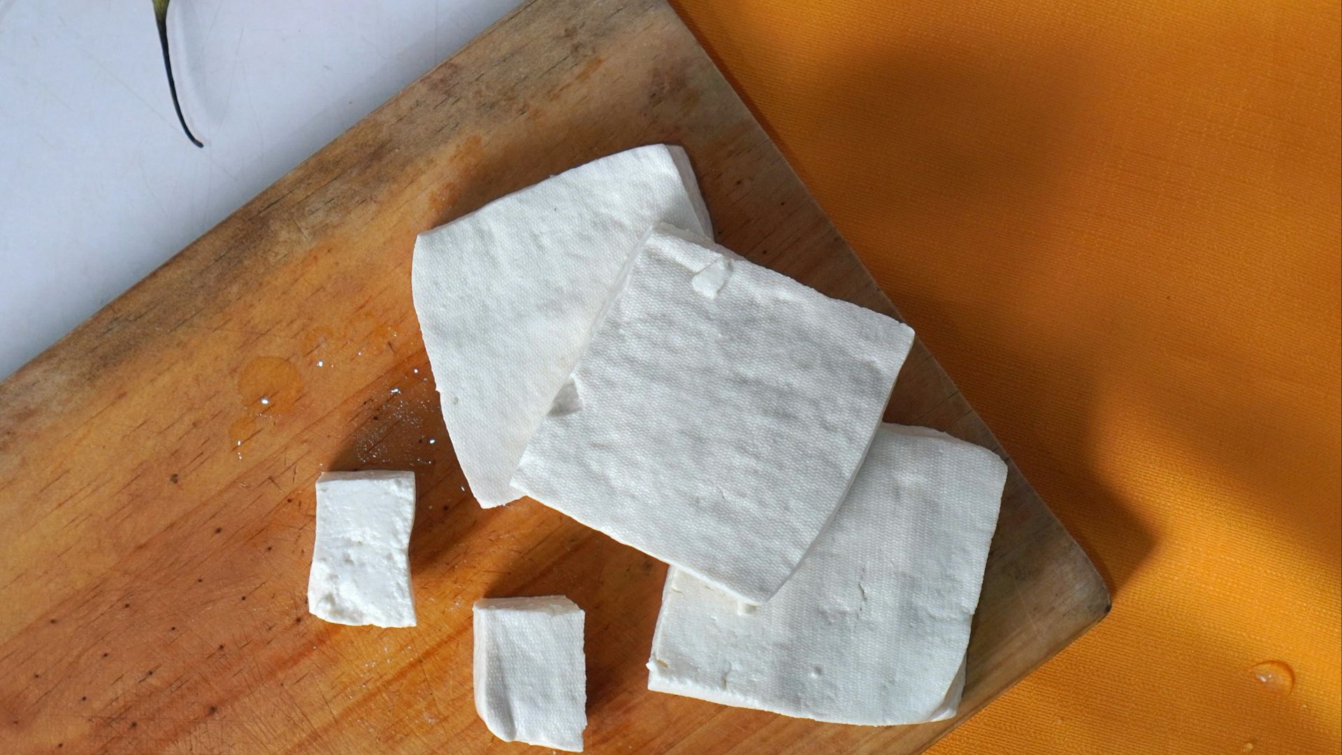 a white napkin on a cutting board