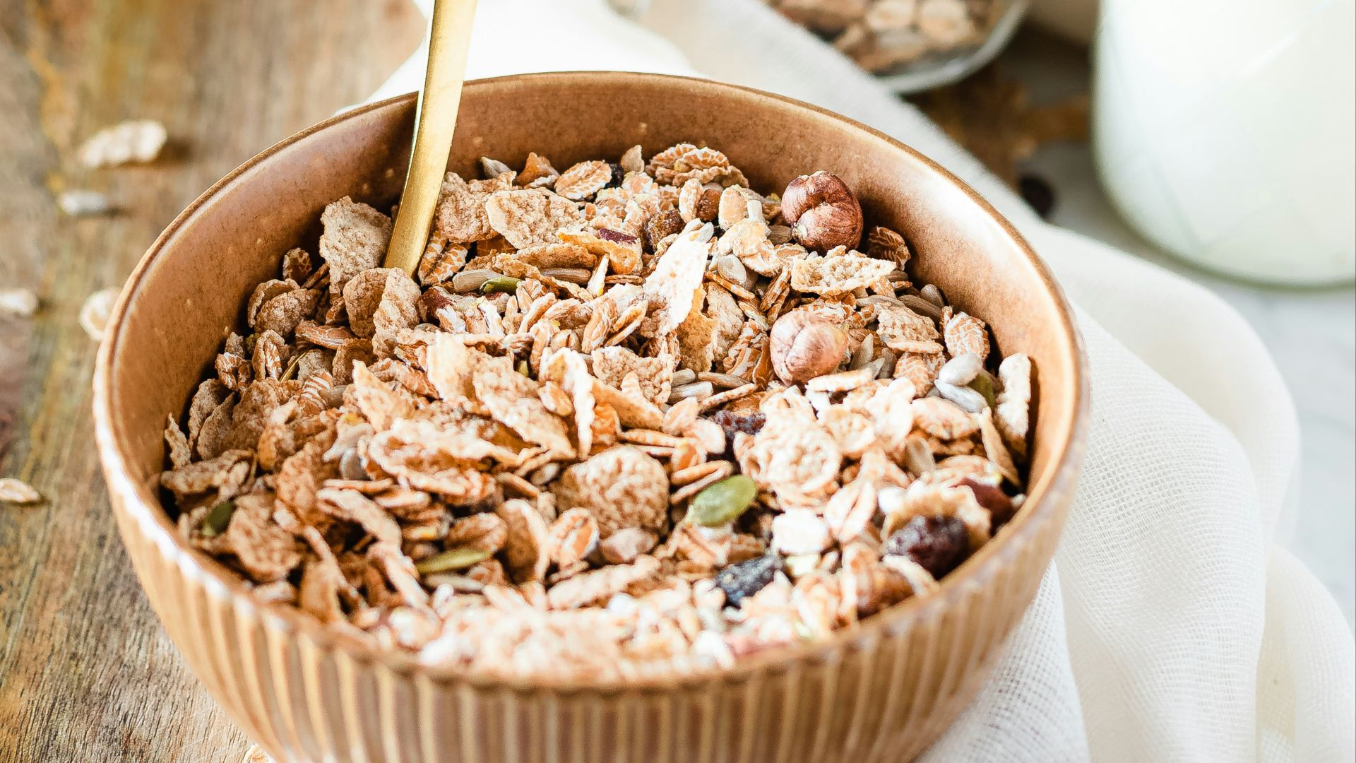 brown wooden bowl with brown wooden spoon