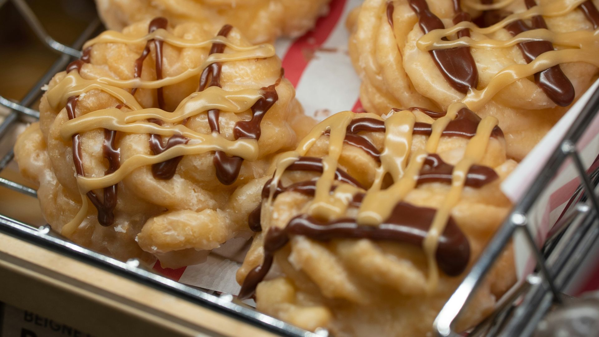 a bunch of doughnuts that are on a rack