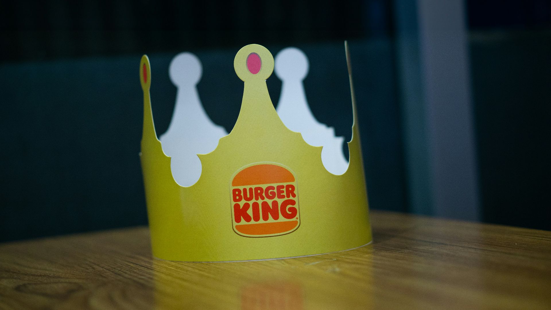 a paper crown sitting on top of a wooden table