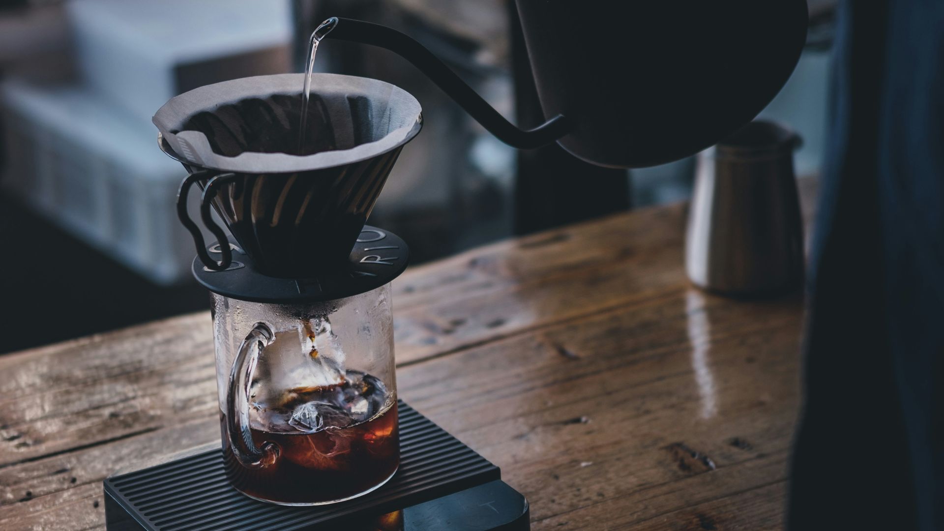 black ceramic mug on brown wooden table