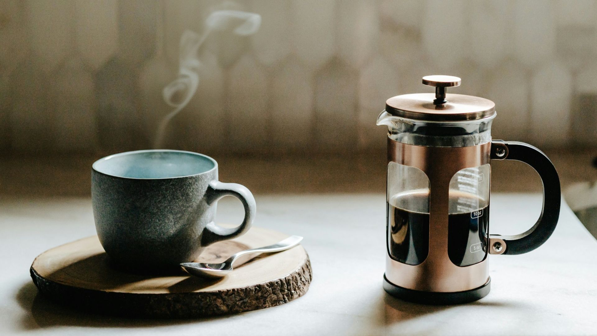 A cup of coffee sitting on top of a kitchen counter
