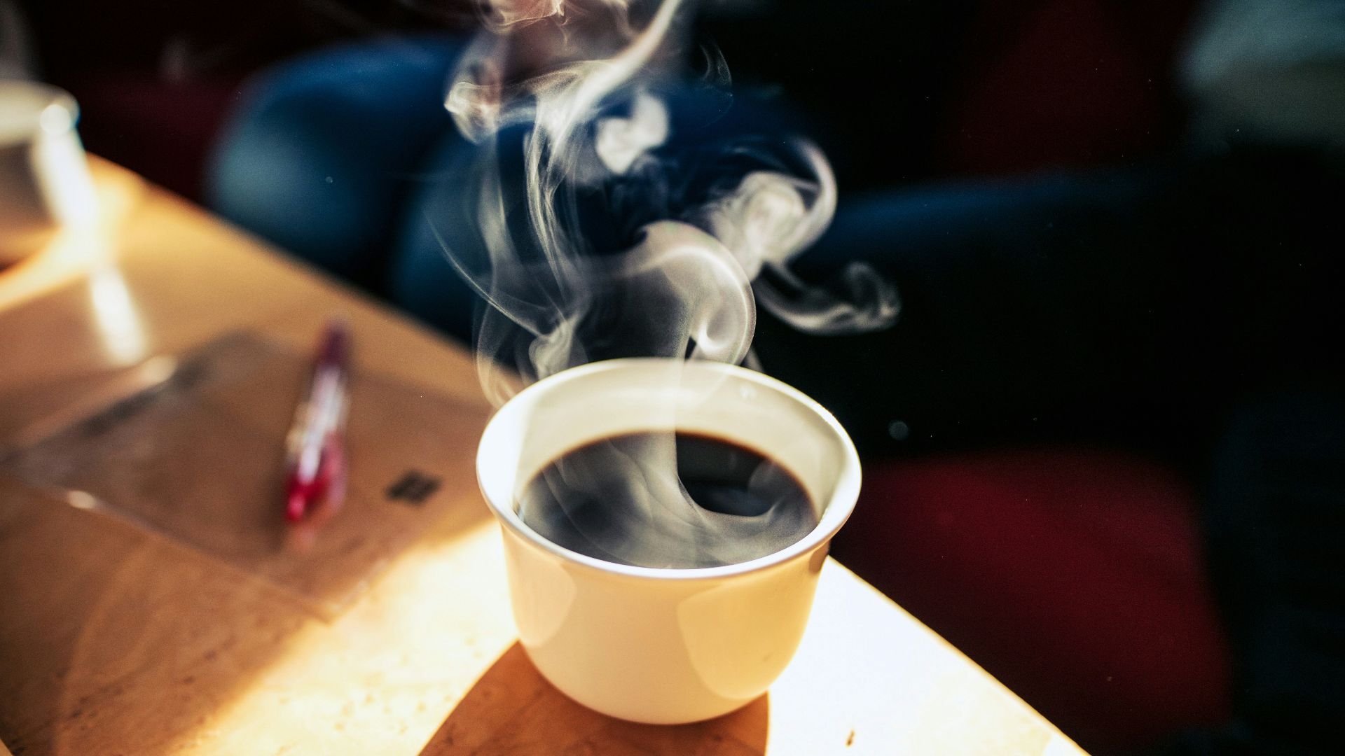white coffee cup on table