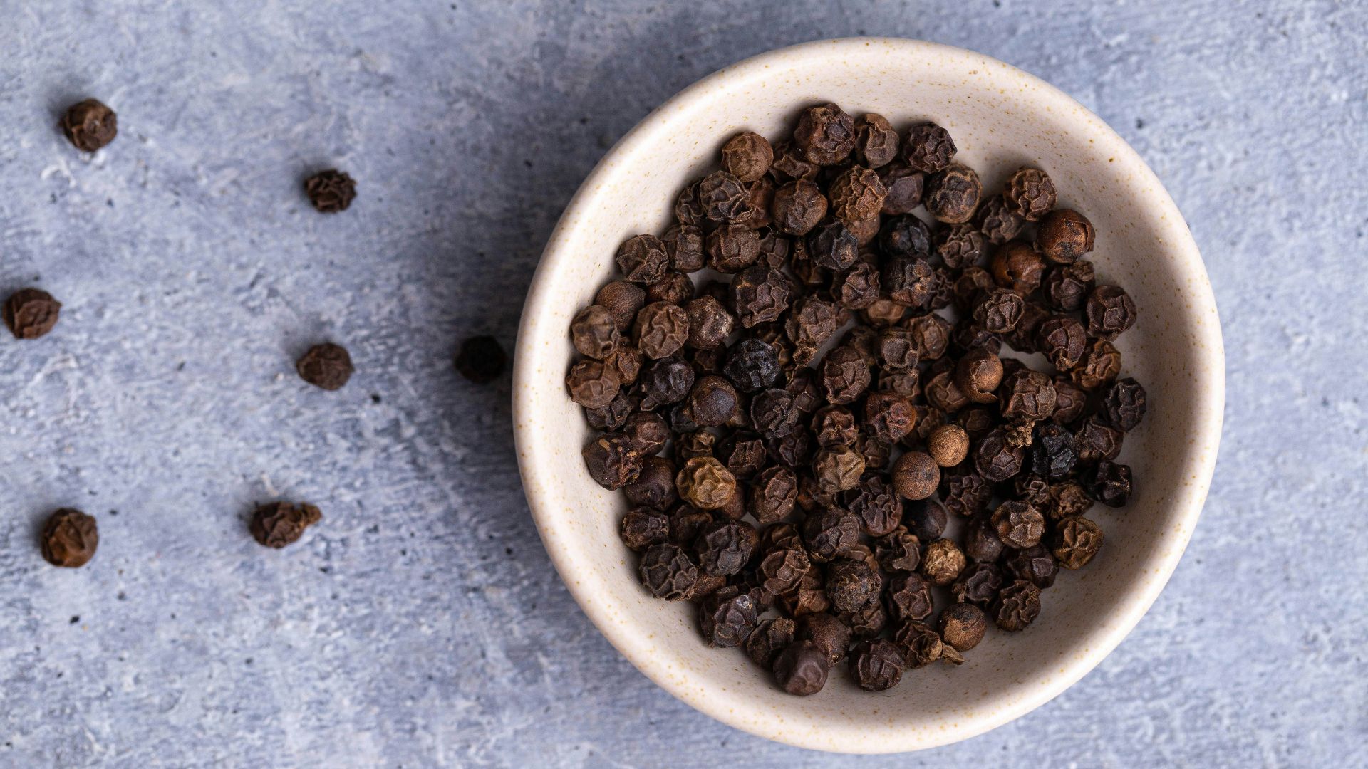 brown coffee beans on white ceramic bowl