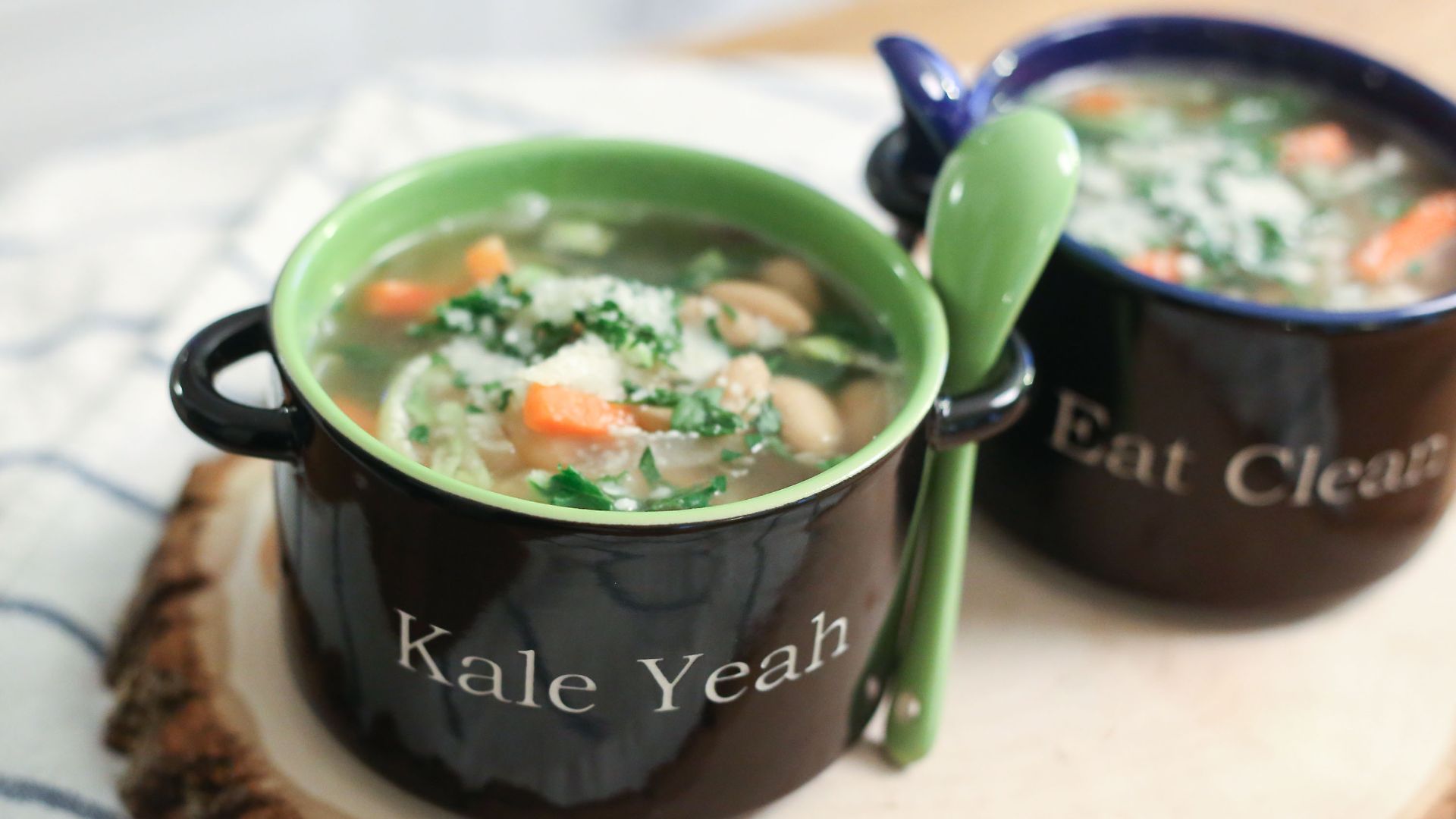 File:Tuscan kale and white bean soup in personalized bowls with spoons on a decorative tree cross cut (16085794138).jpg