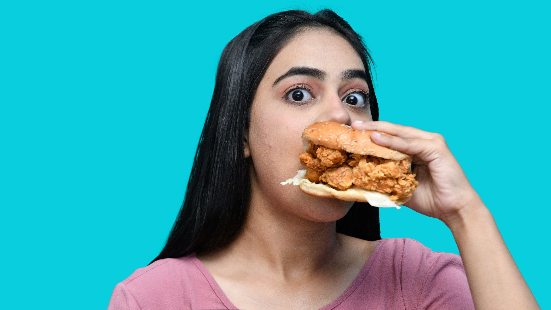 a woman eating a sandwich