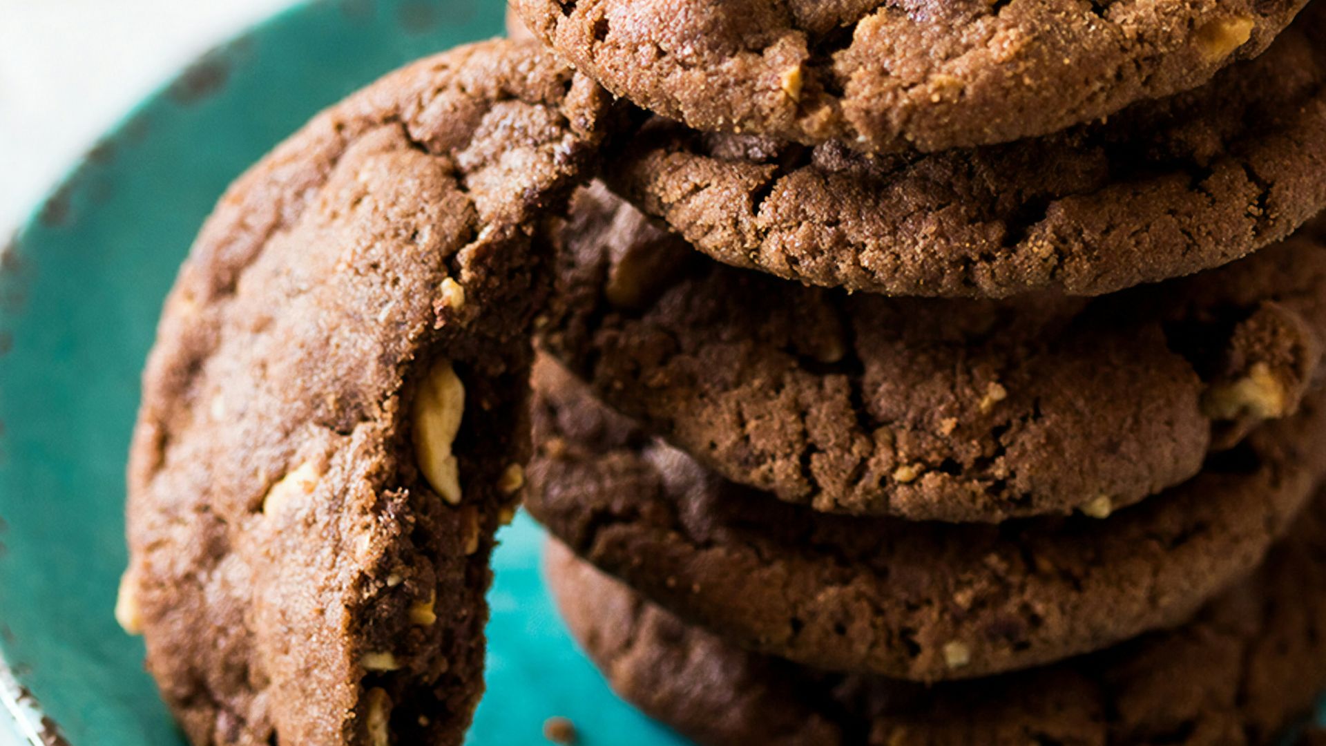 brown cookies on blue and white ceramic plate