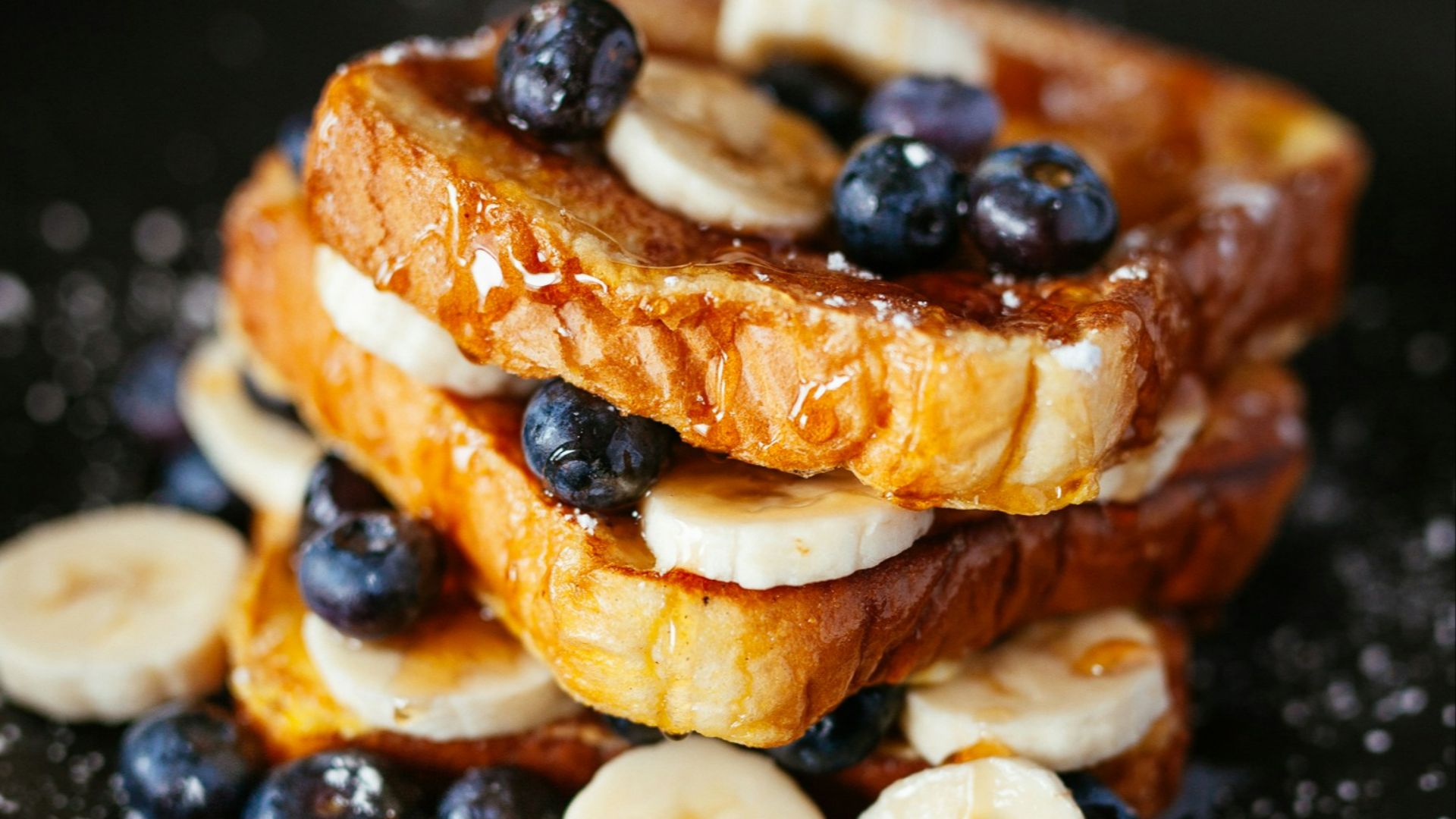 toast bread with blueberry on black plate