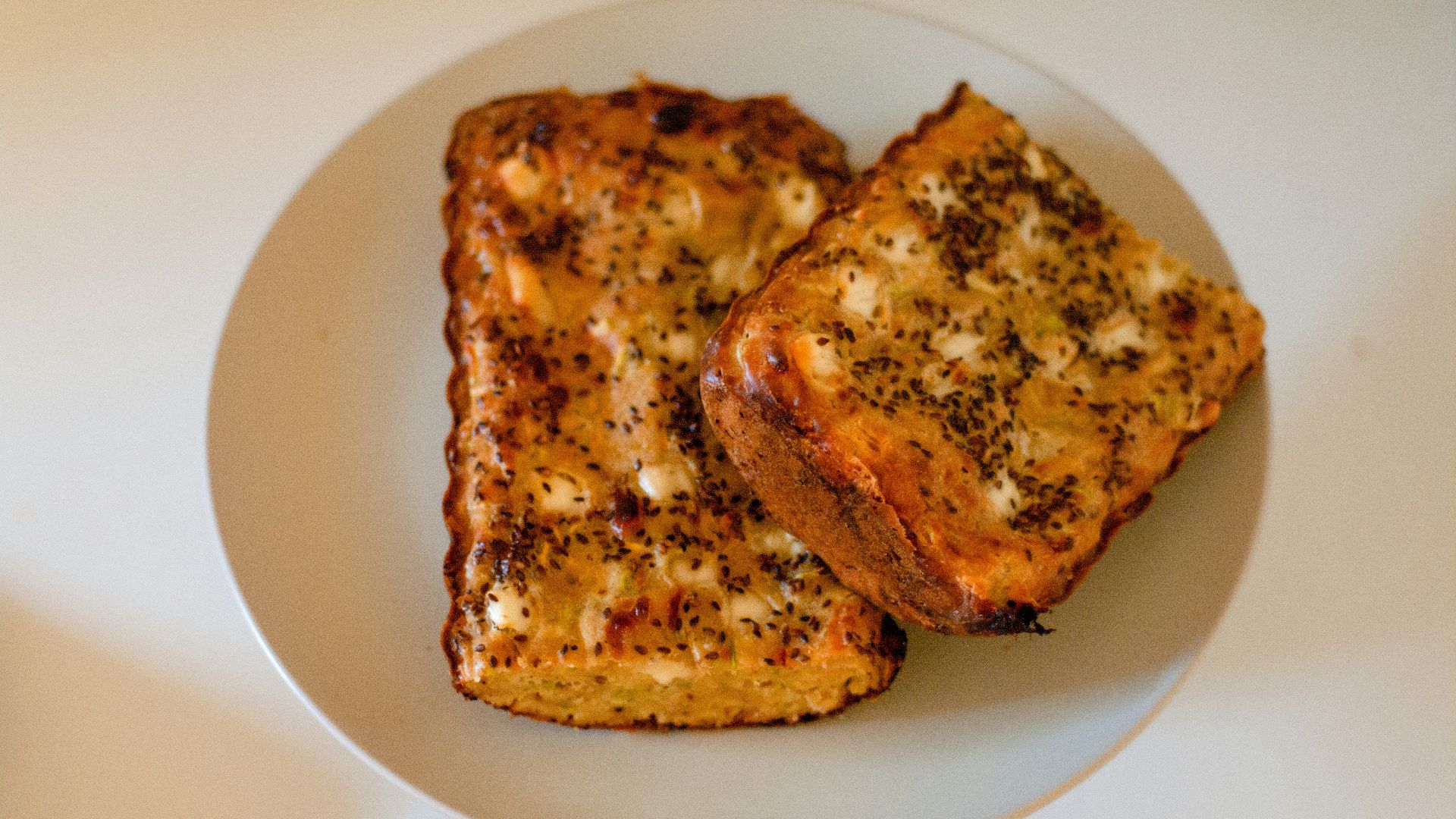 two pieces of toast on a white plate