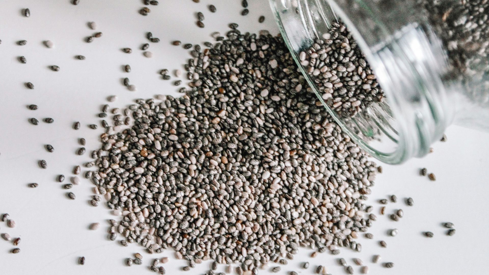 black beads in clear glass jar