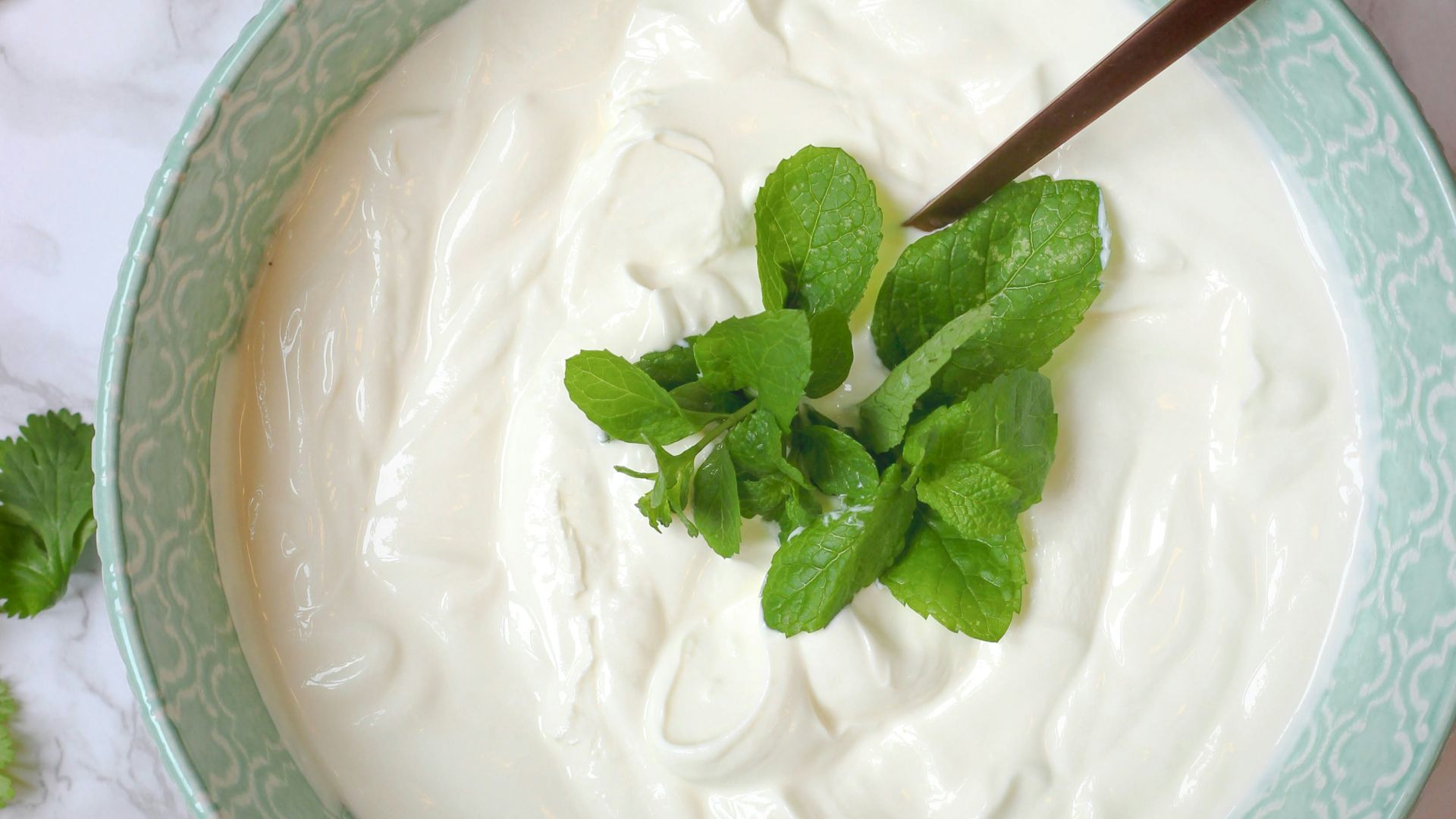 a bowl of yogurt with a spoon in it