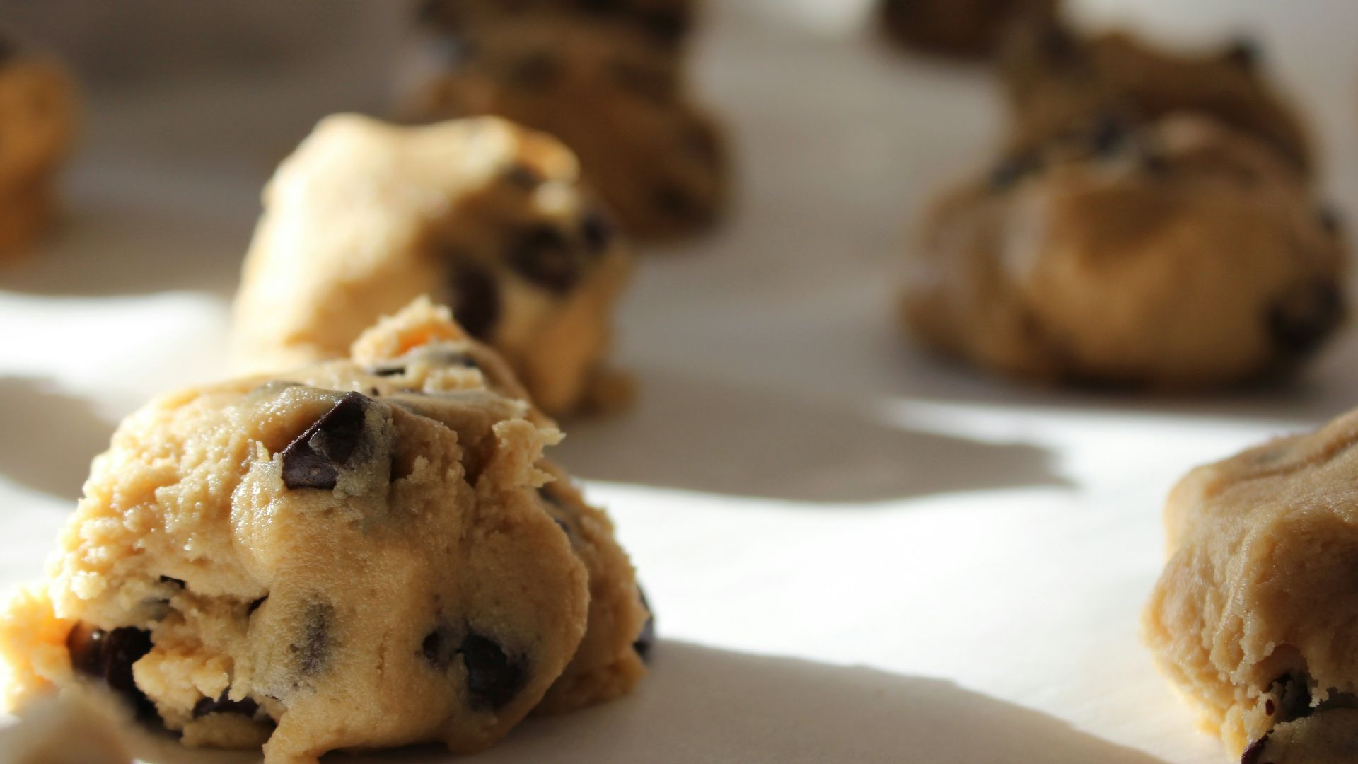 round chocolate cookies on white surface