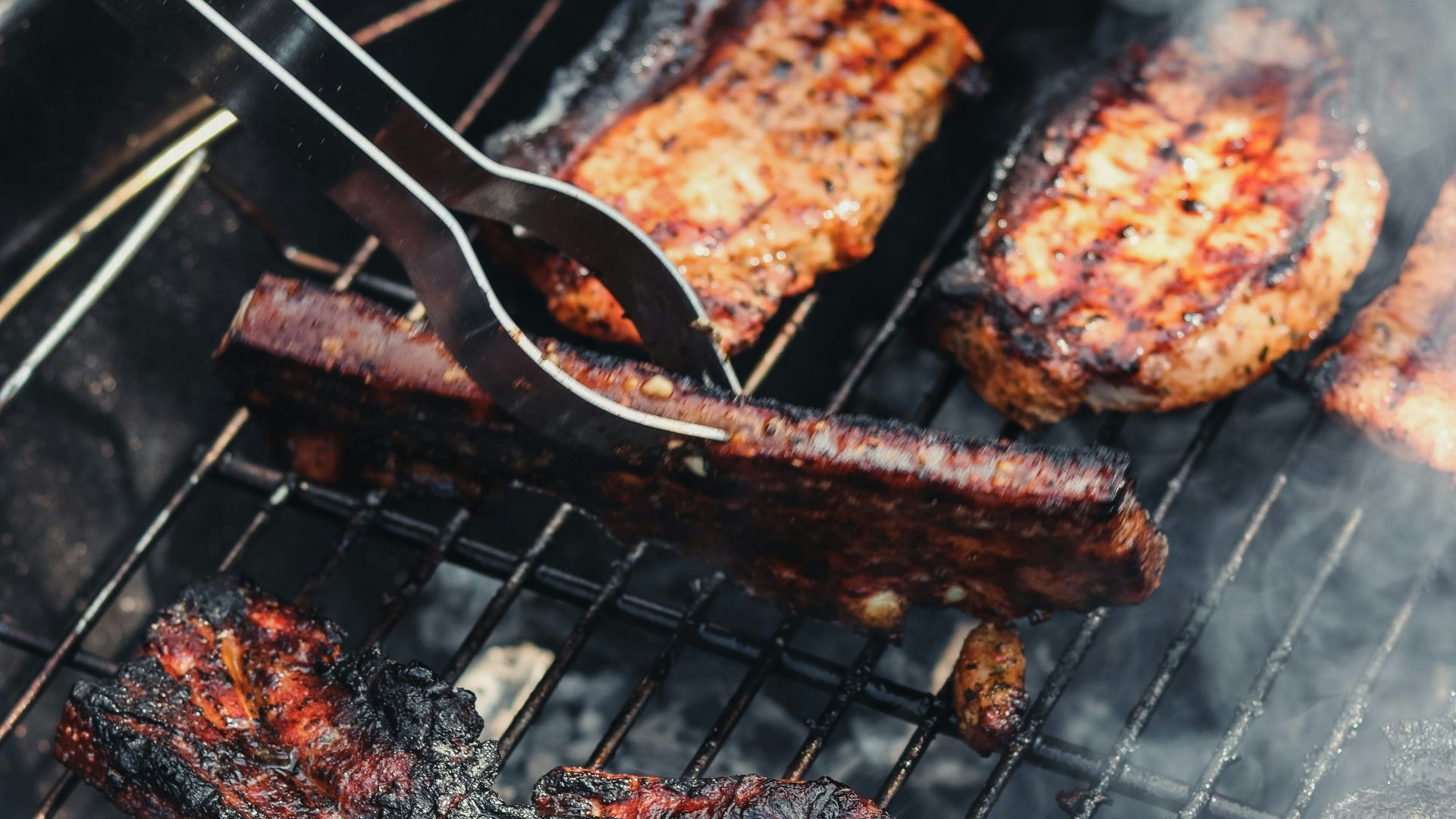 grilled meat on black charcoal grill