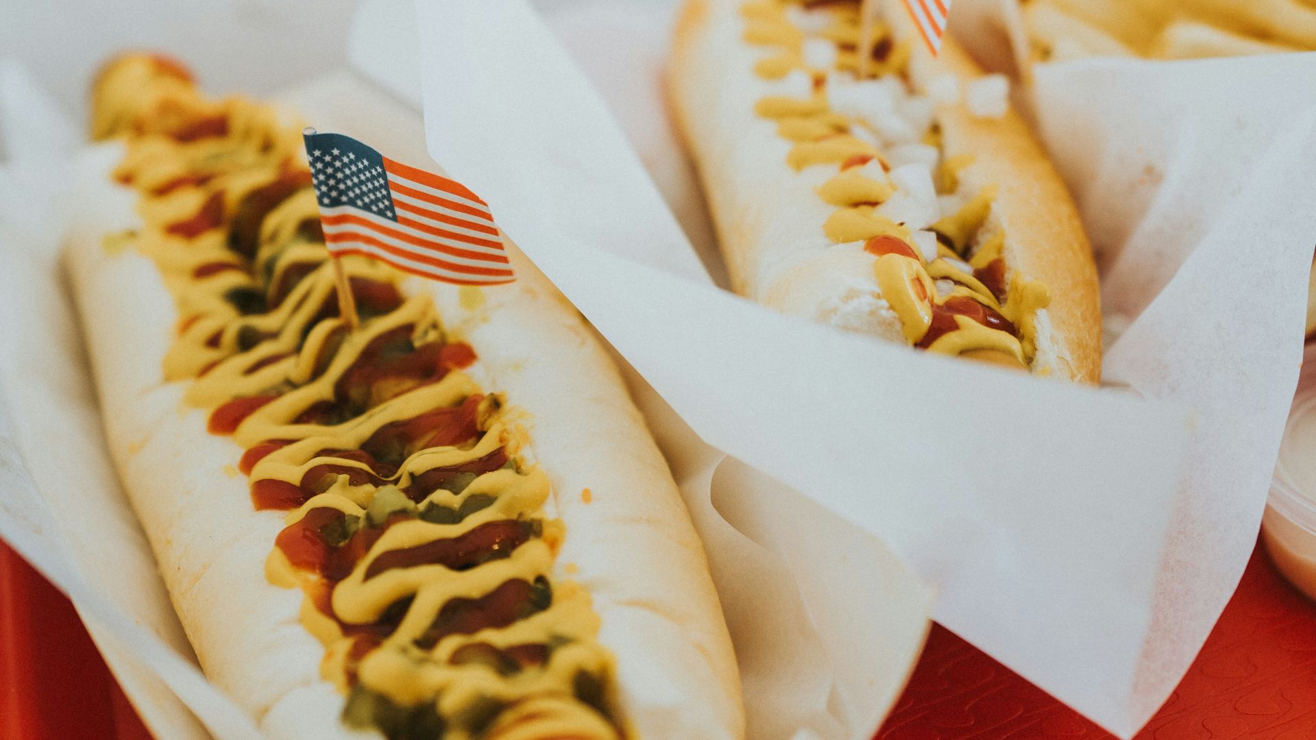 closeup photo of two hotdogs on tray