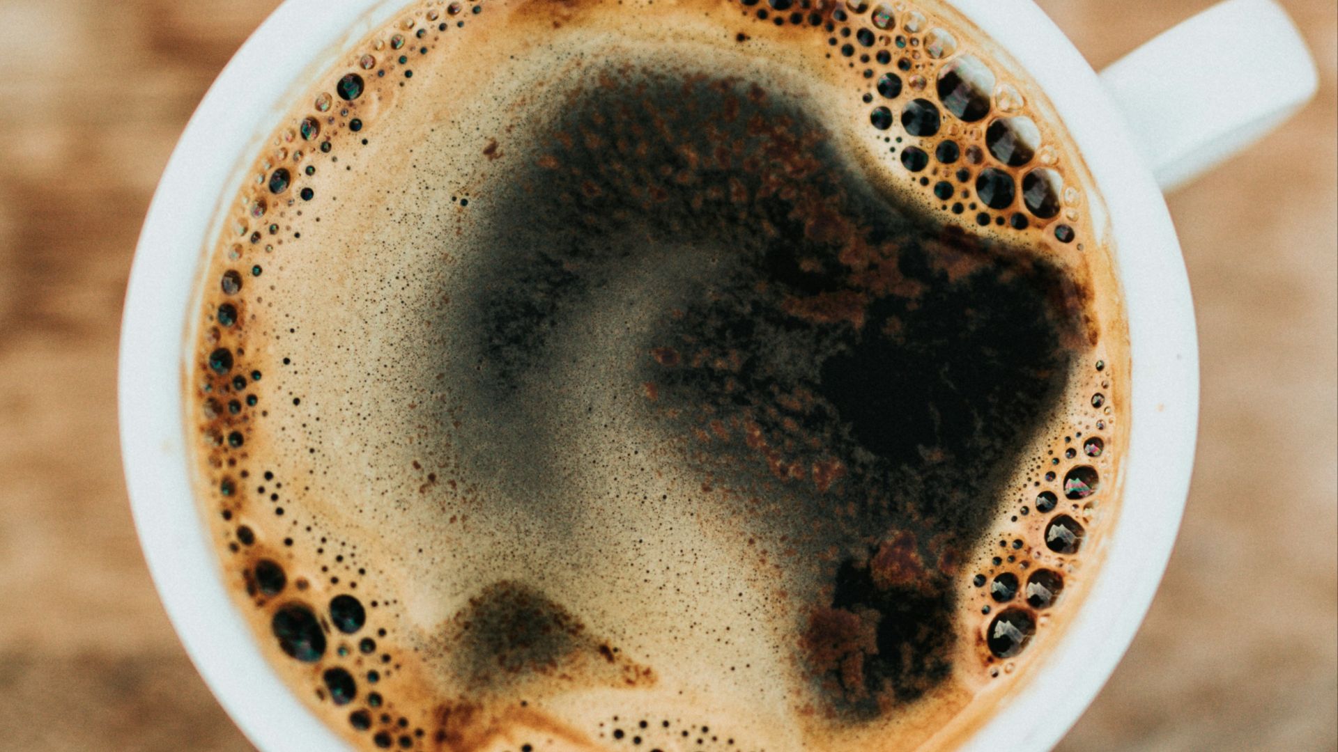 white ceramic mug filled with coffee
